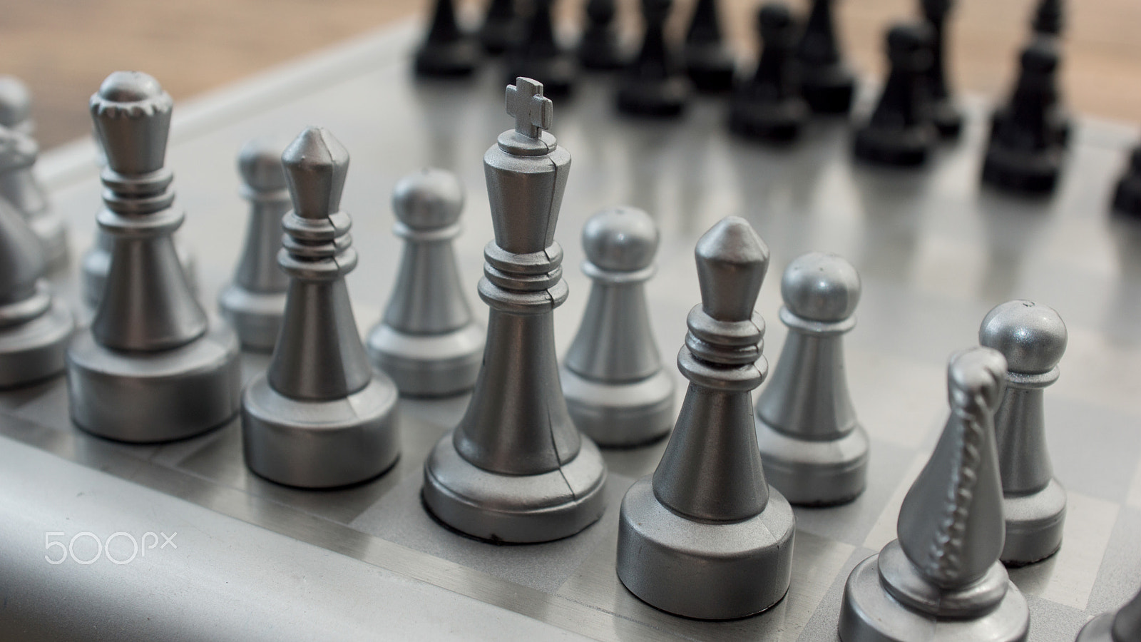 Sony SLT-A77 + Minolta AF 28-85mm F3.5-4.5 sample photo. Light and dark wooden chess pieces on chess table. photography