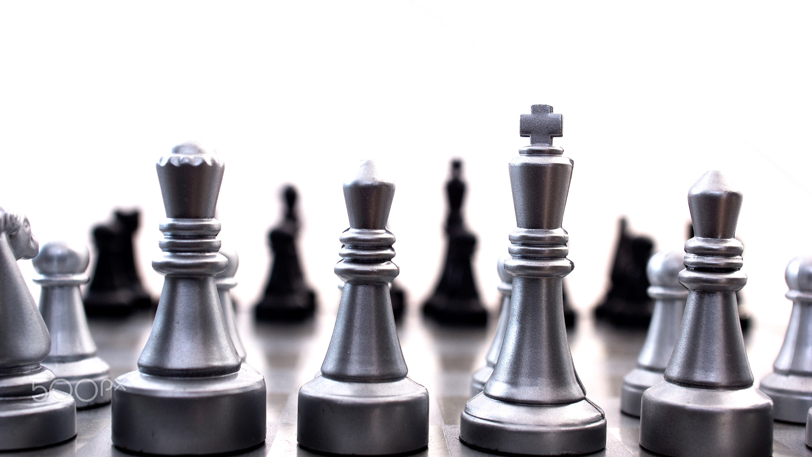 Sony SLT-A77 + Minolta AF 28-85mm F3.5-4.5 sample photo. Light and dark wooden chess pieces on chess table. photography