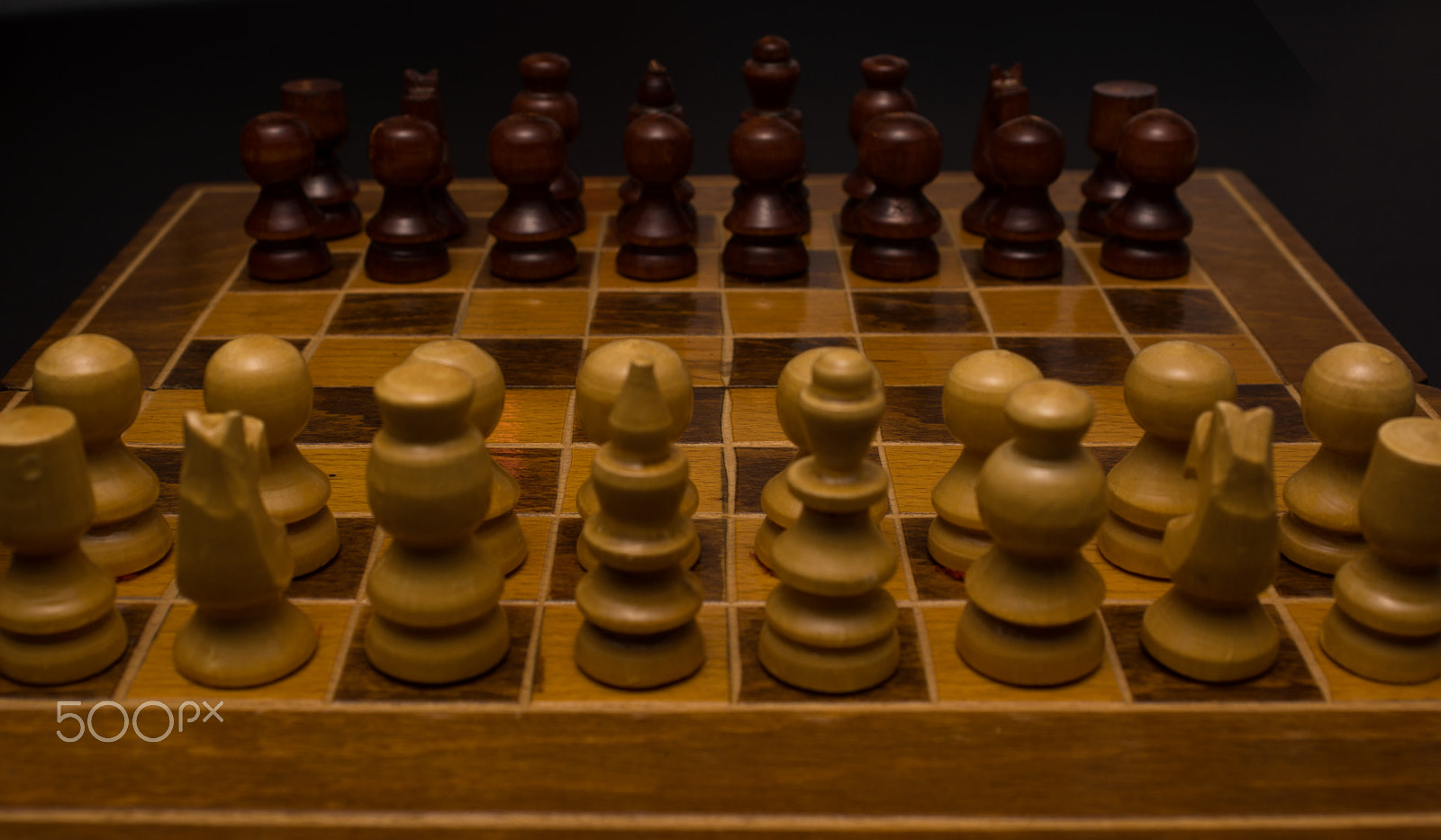 Sony SLT-A77 + Minolta AF 28-85mm F3.5-4.5 sample photo. Light and dark wooden chess pieces on chess table. photography