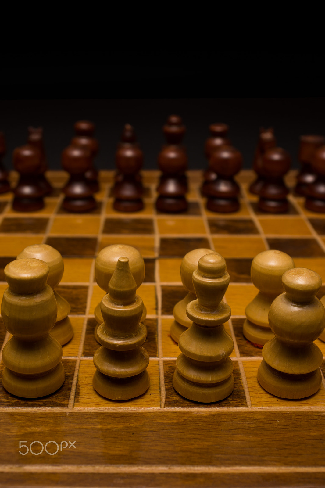 Minolta AF 28-85mm F3.5-4.5 sample photo. Light and dark wooden chess pieces on chess table. photography