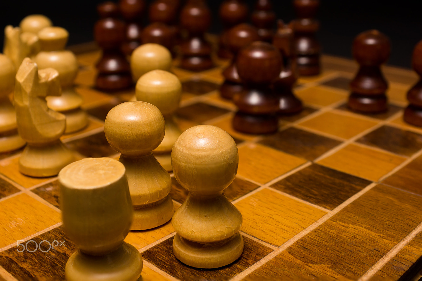 Sony SLT-A77 + Minolta AF 28-85mm F3.5-4.5 sample photo. Light and dark wooden chess pieces on chess table. photography