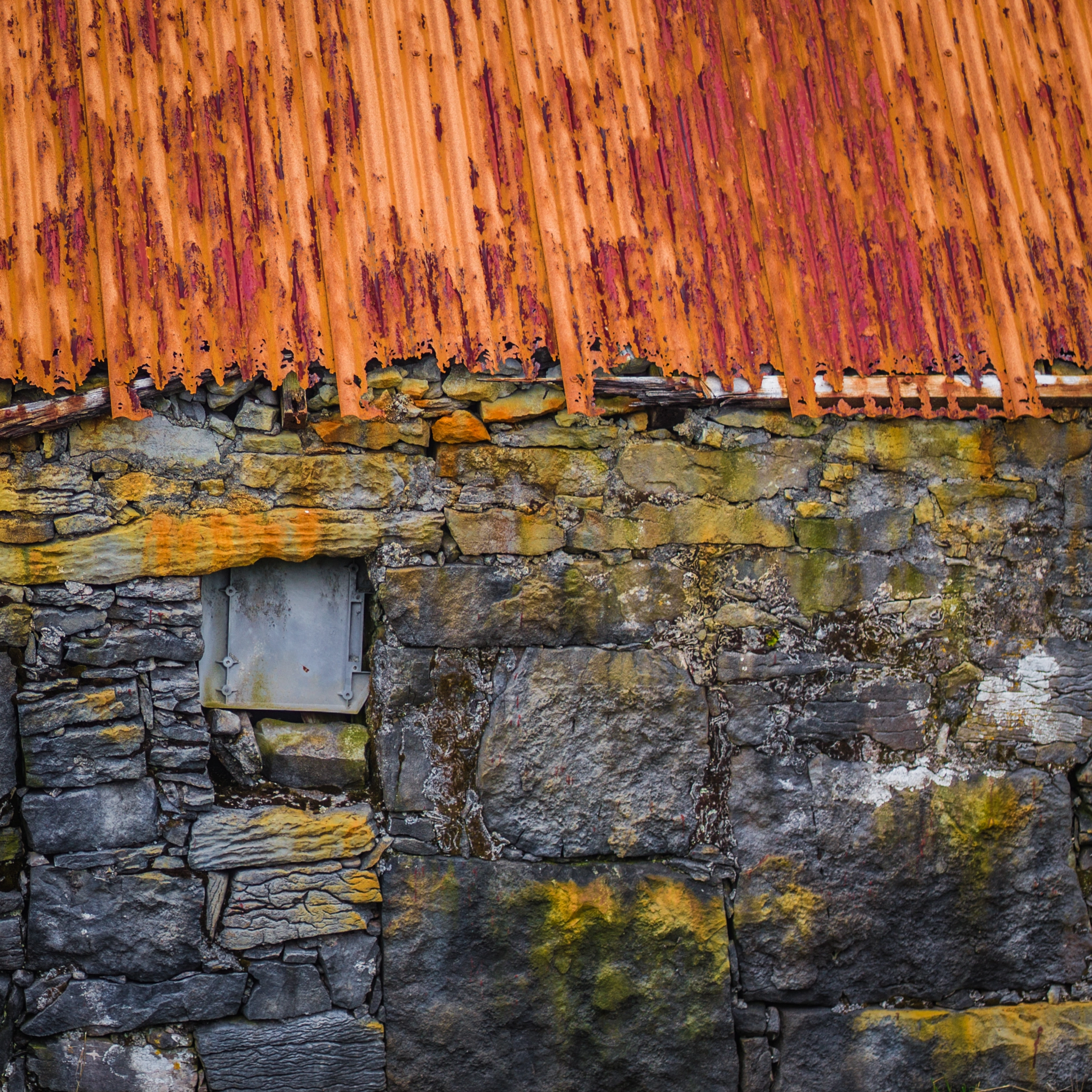 Hasselblad H5D + HC 80 sample photo. Details of wall under orange roof photography