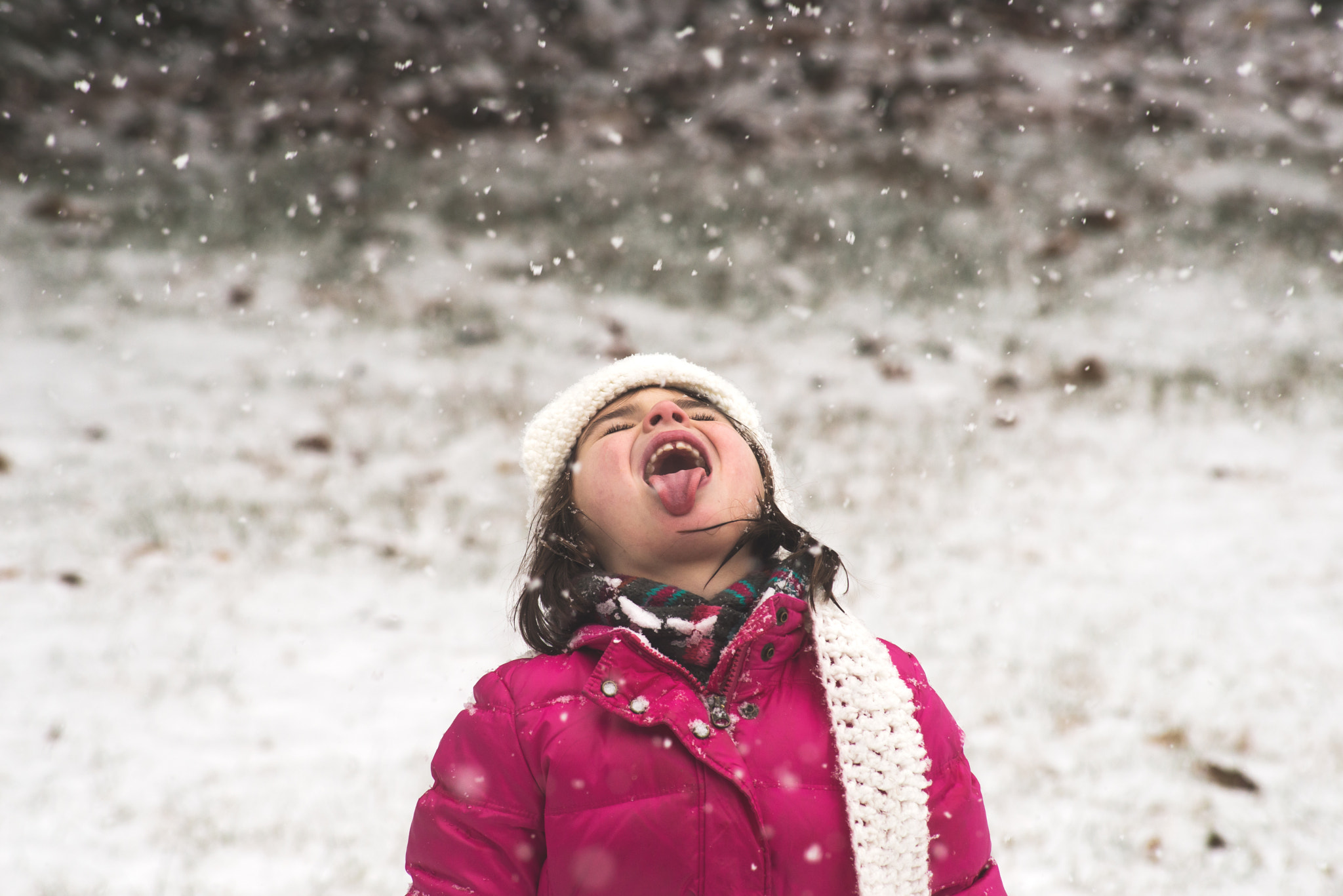Nikon D610 + AF Nikkor 70-210mm f/4-5.6 sample photo. Little girl trying to catch snowflakes photography