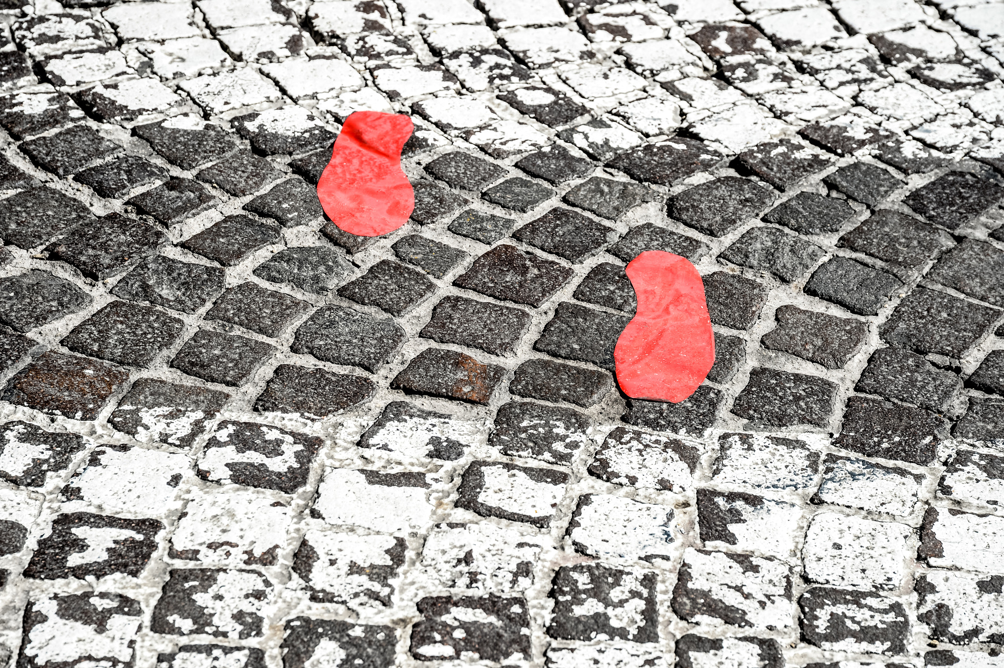 Nikon Df + Sigma 24-105mm F4 DG OS HSM Art sample photo. Red footsteps in town photography