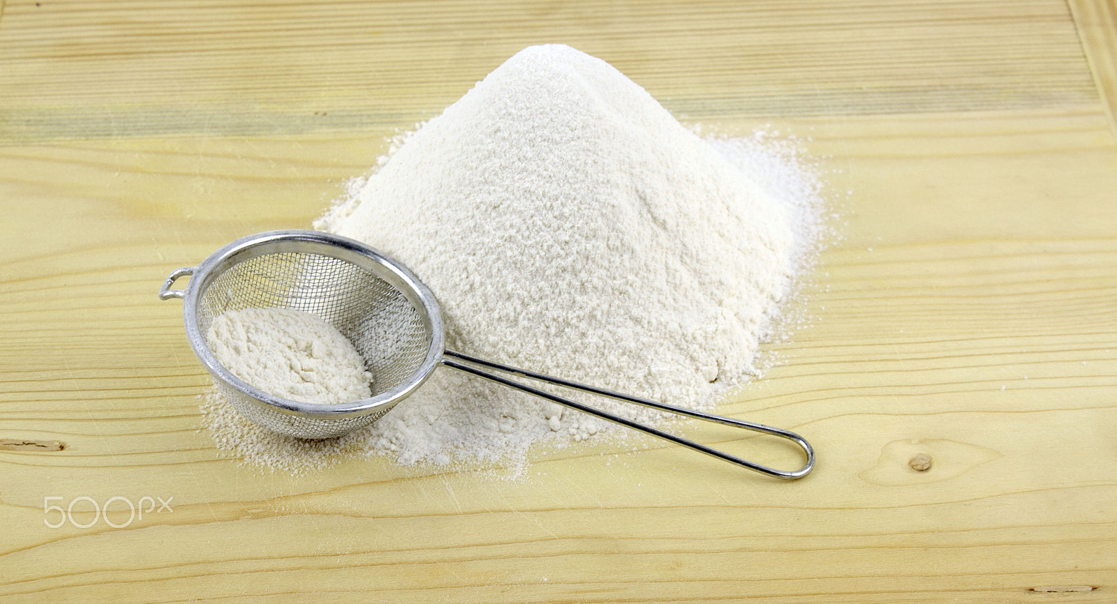 Canon EF-S 18-55mm F3.5-5.6 III sample photo. Flour on a wooden board photography