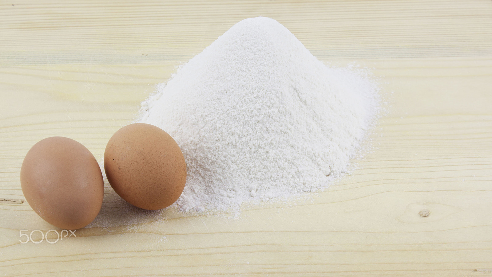 Canon EF-S 18-55mm F3.5-5.6 III sample photo. Flour and eggs on a wooden board photography