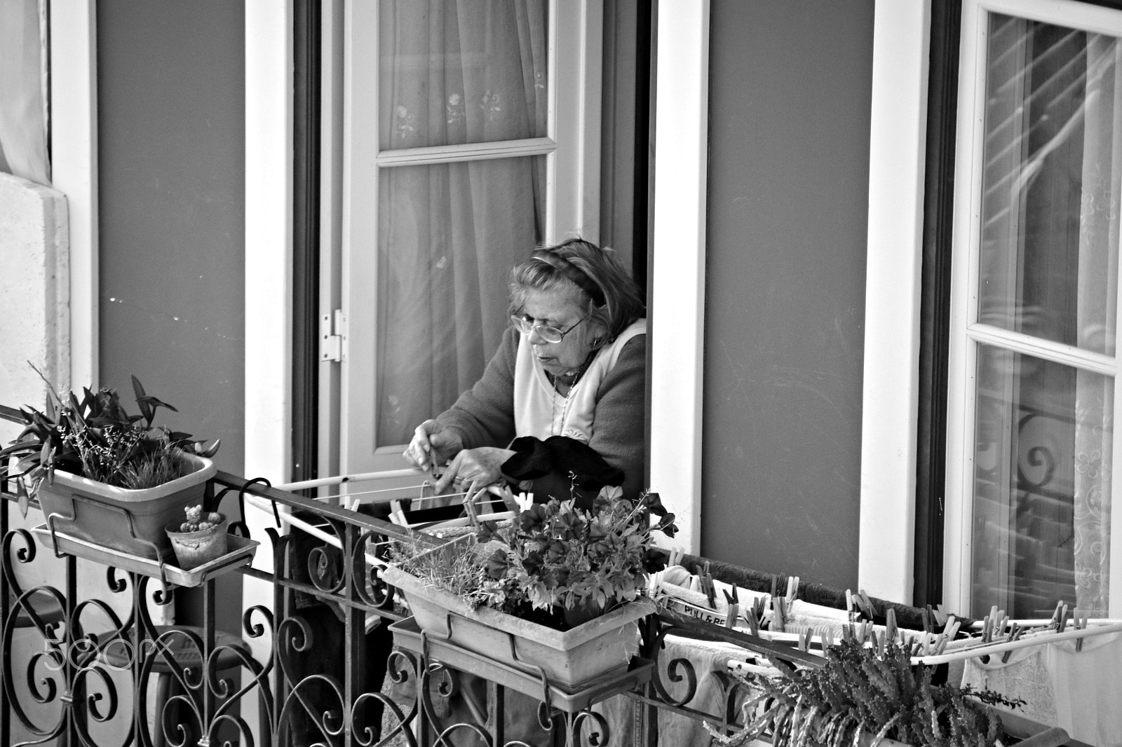 Canon TS-E 90mm F2.8 Tilt-Shift sample photo. Lady in balcony photography