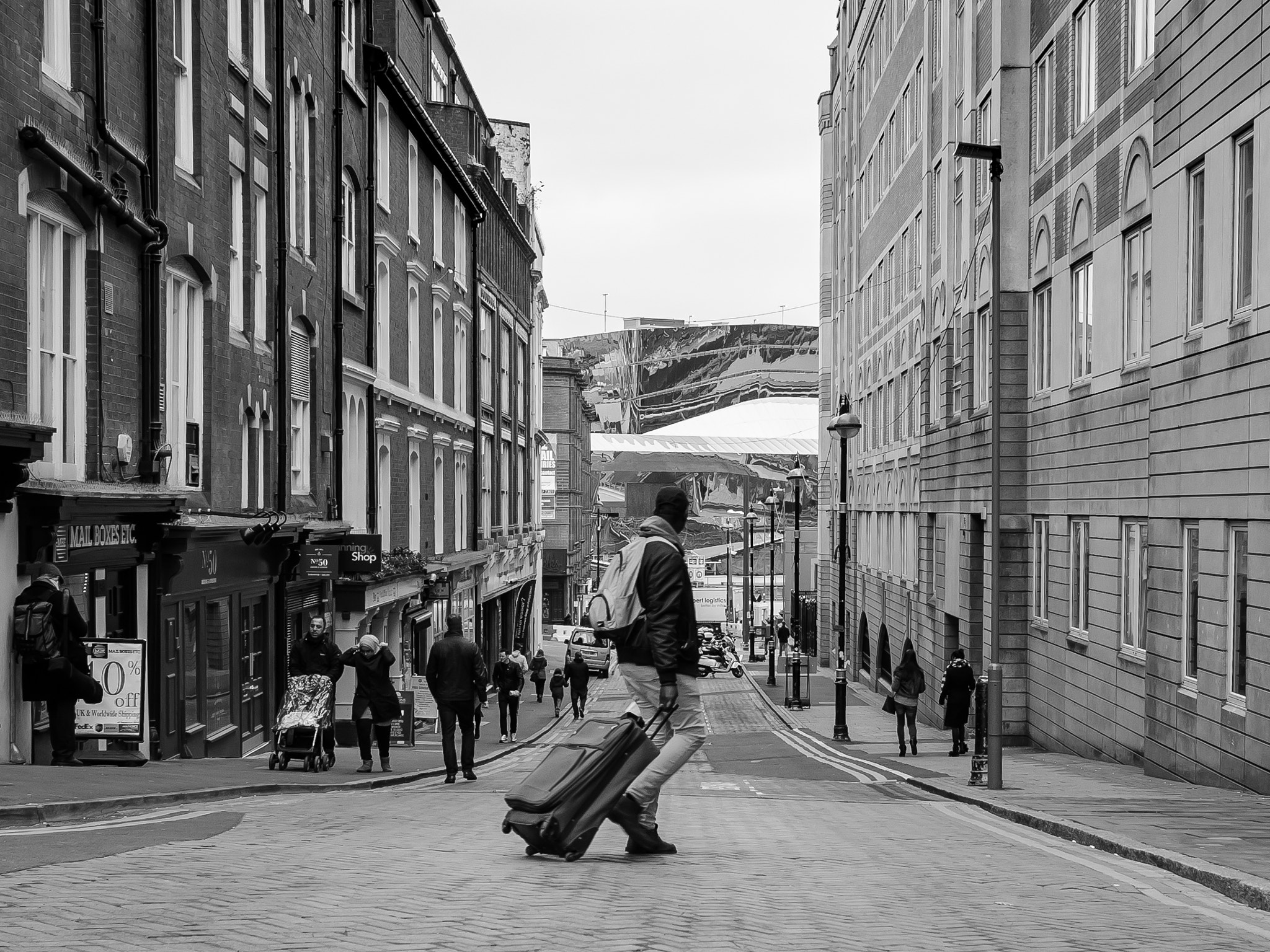 Sigma 17-70mm F2.8-4 DC Macro OS HSM | C sample photo. Man walking with suitcase photography