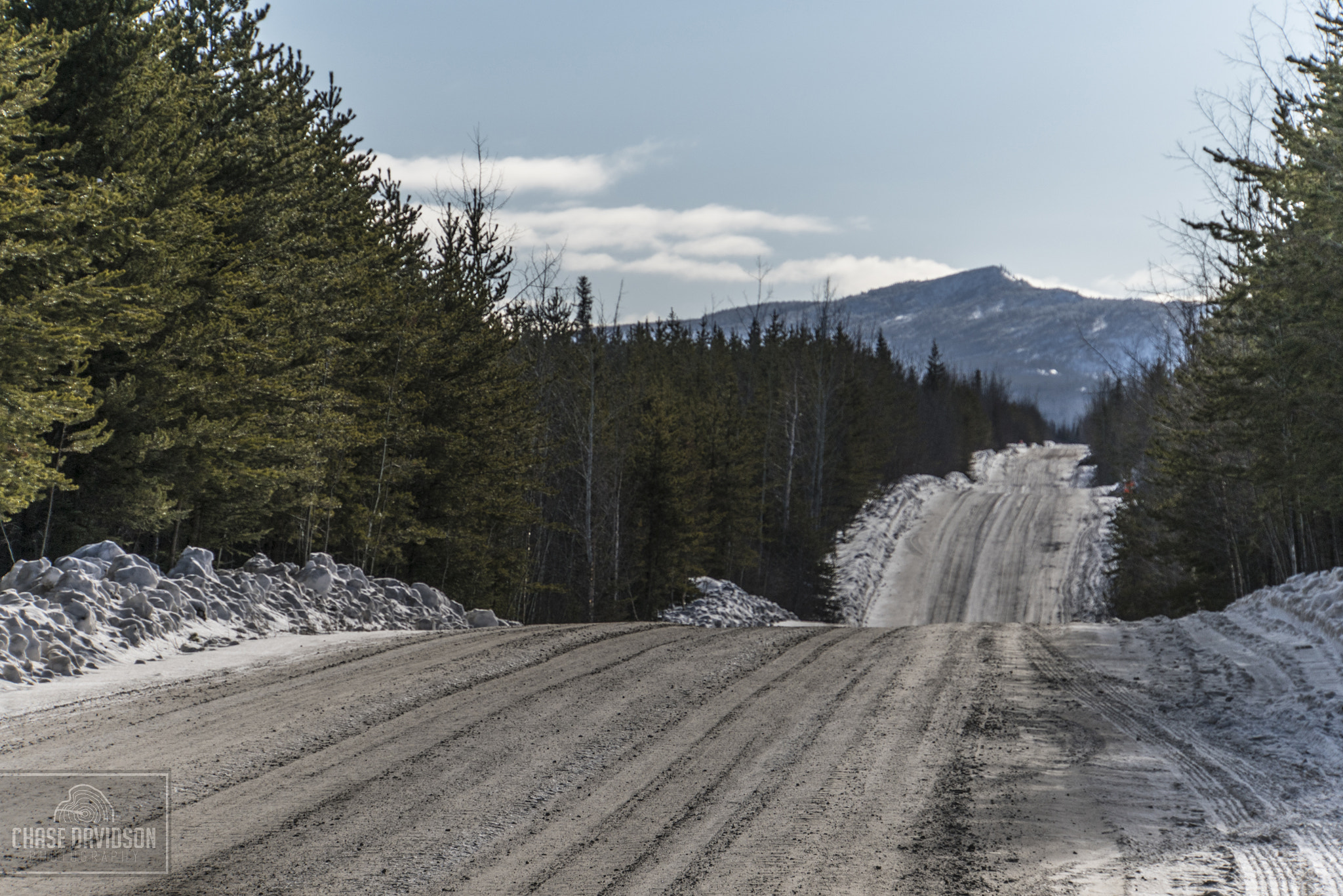 Sony a7R II + Sony E 18-200mm F3.5-6.3 OSS LE sample photo. Winter road to mountain photography