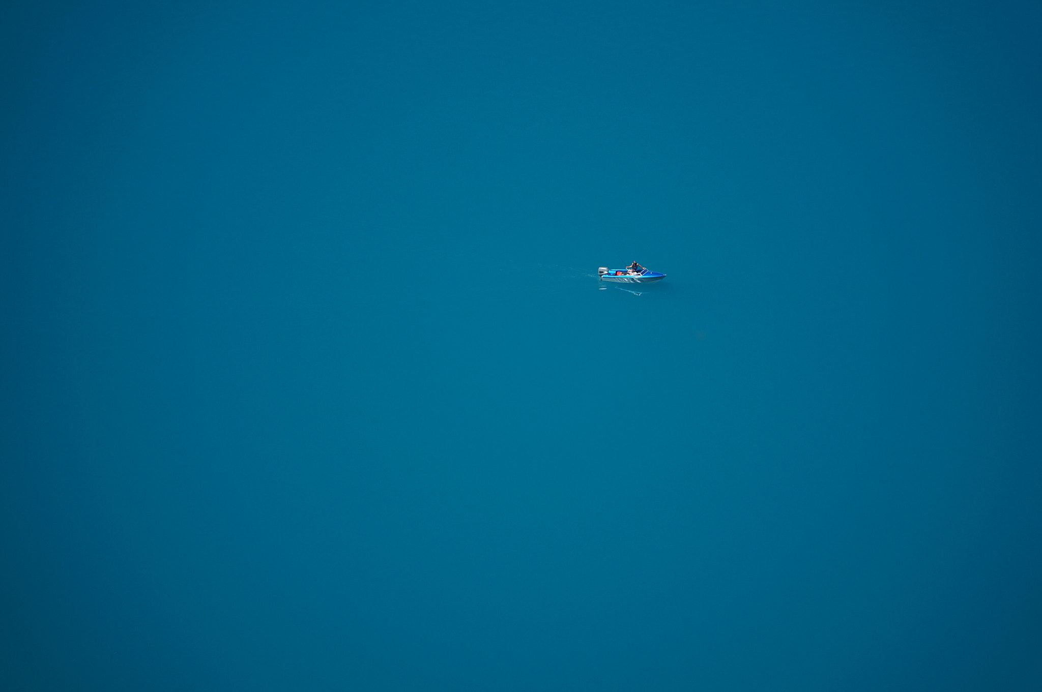 Sony Alpha NEX-6 + Sony E PZ 18-105mm F4 G OSS sample photo. Tranquil boat on lake hawea photography