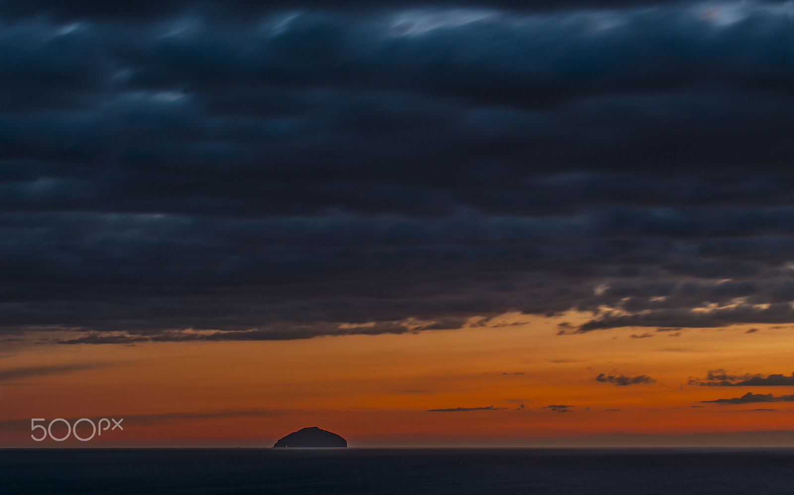 Pentax K20D + Sigma sample photo. Sunset with rolling clouds over ailsa craig photography