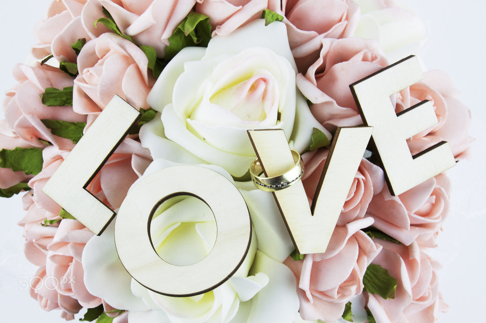 Canon EF-S 18-55mm F3.5-5.6 III sample photo. Table arrangement with roses, wedding rings and lo photography