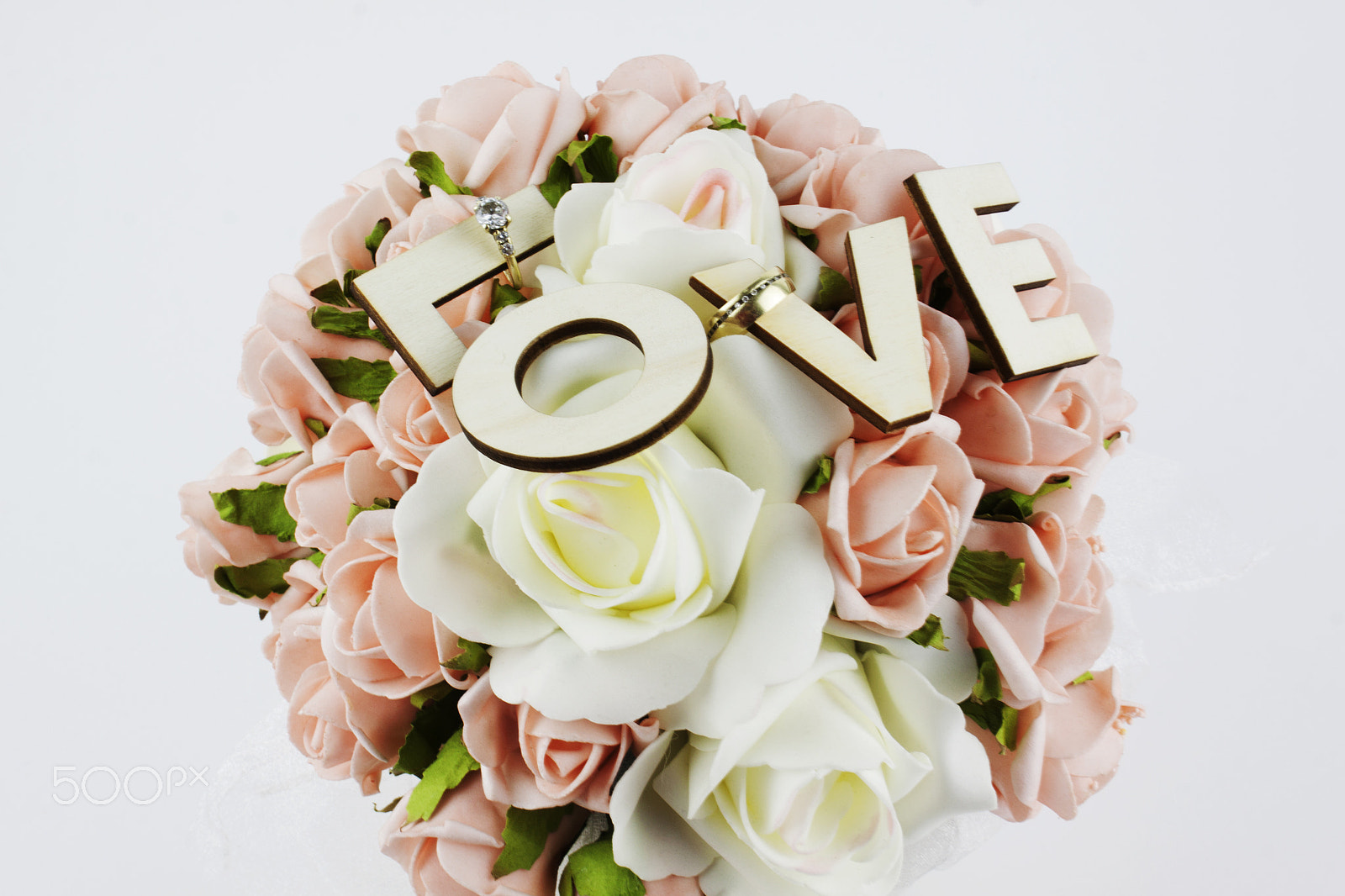 Canon EF-S 18-55mm F3.5-5.6 III sample photo. Table arrangement with roses, wedding rings and lo photography