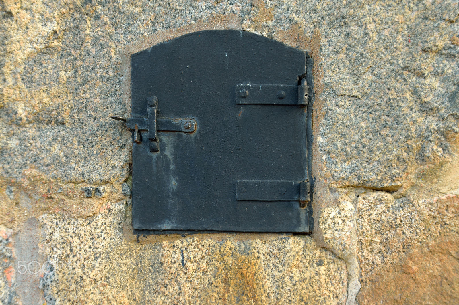 Sigma 18-200mm F3.5-6.3 DC OS HSM sample photo. Old time metal hatch on stone wall photography