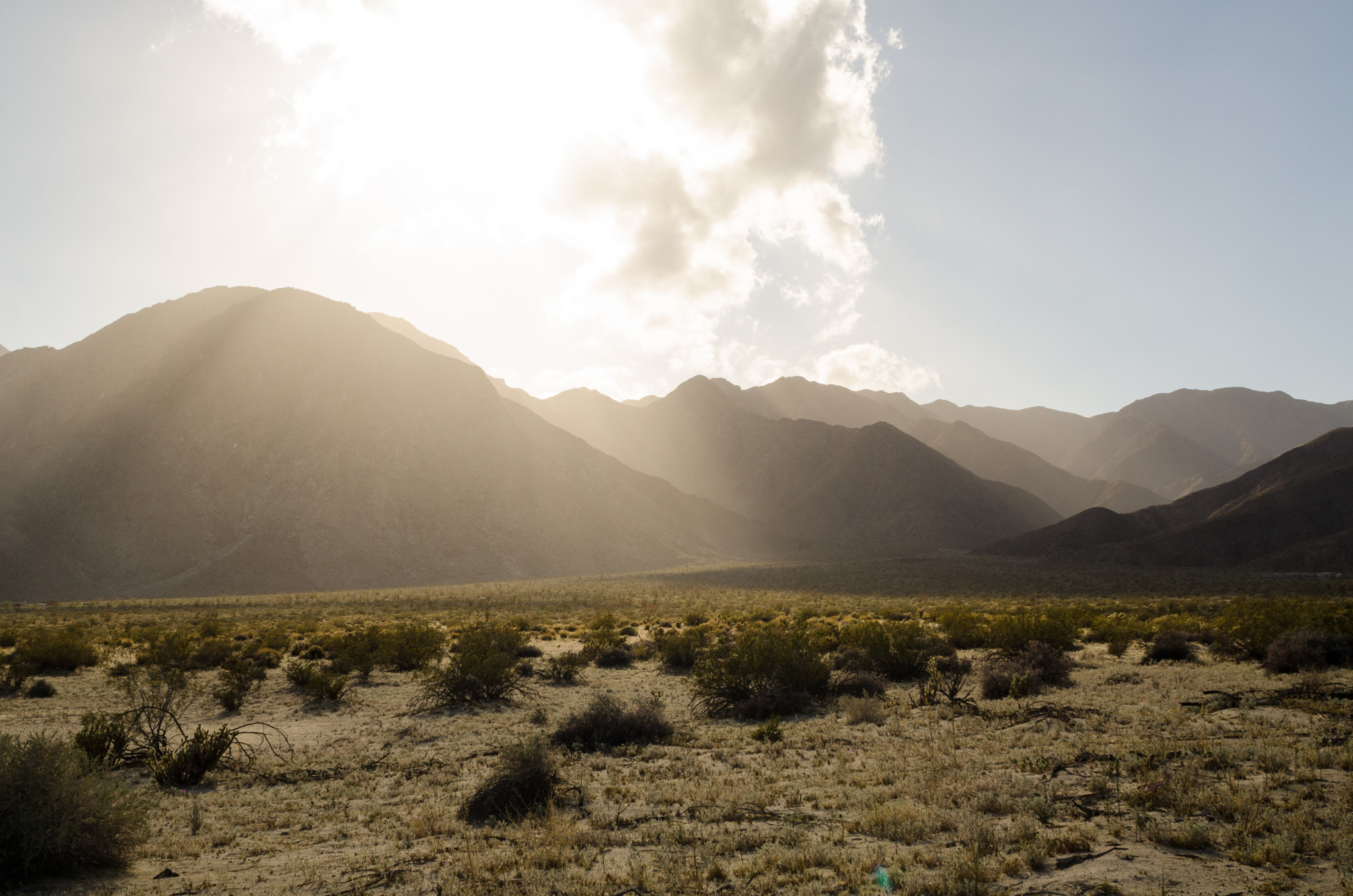Nikon D7000 + Nikon AF Nikkor 24mm F2.8D sample photo. Sun rays over mountains photography