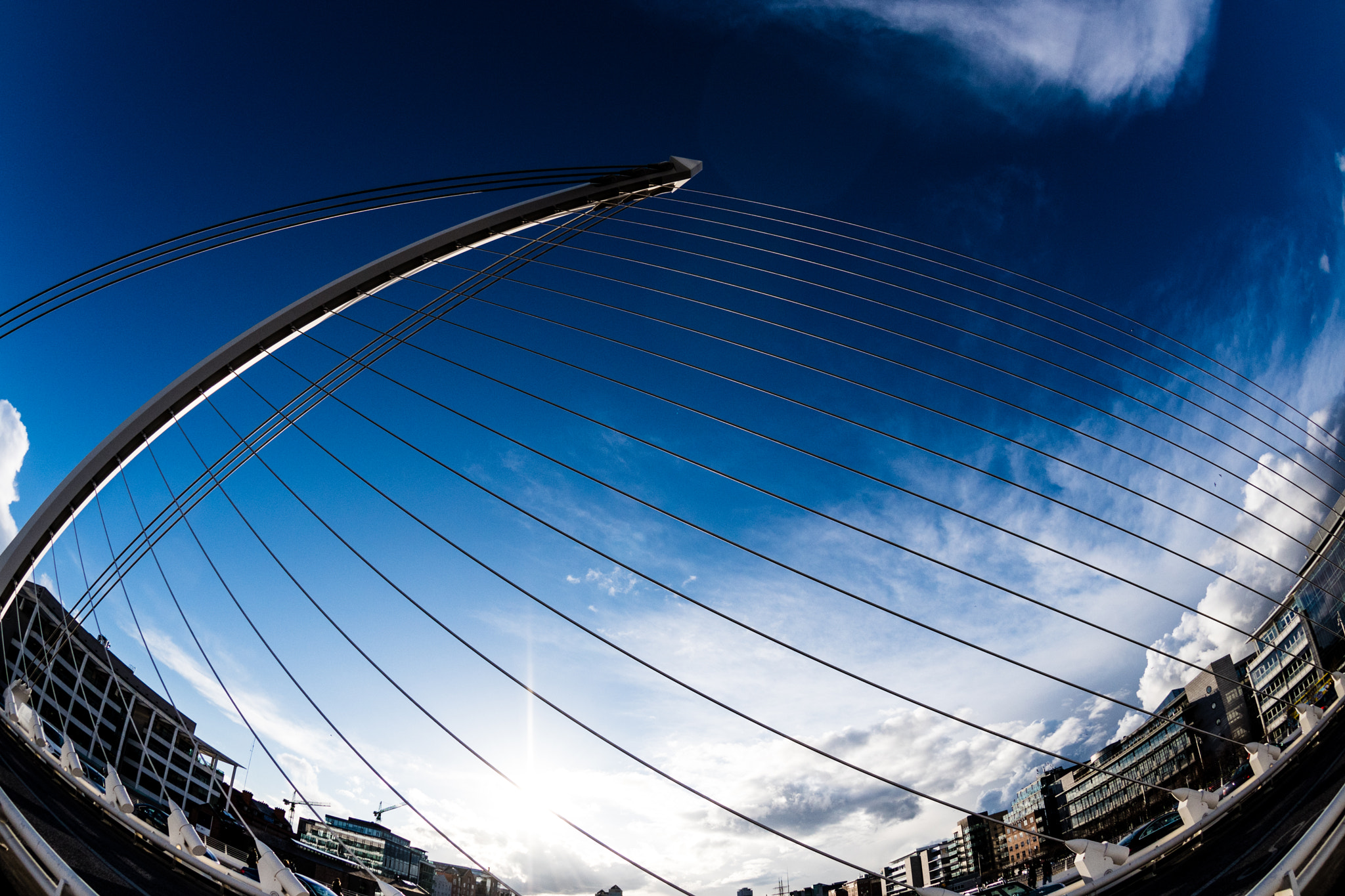 Nikon AF DX Fisheye-Nikkor 10.5mm F2.8G ED sample photo. Views of the samuel beckett bridge in the evening photography
