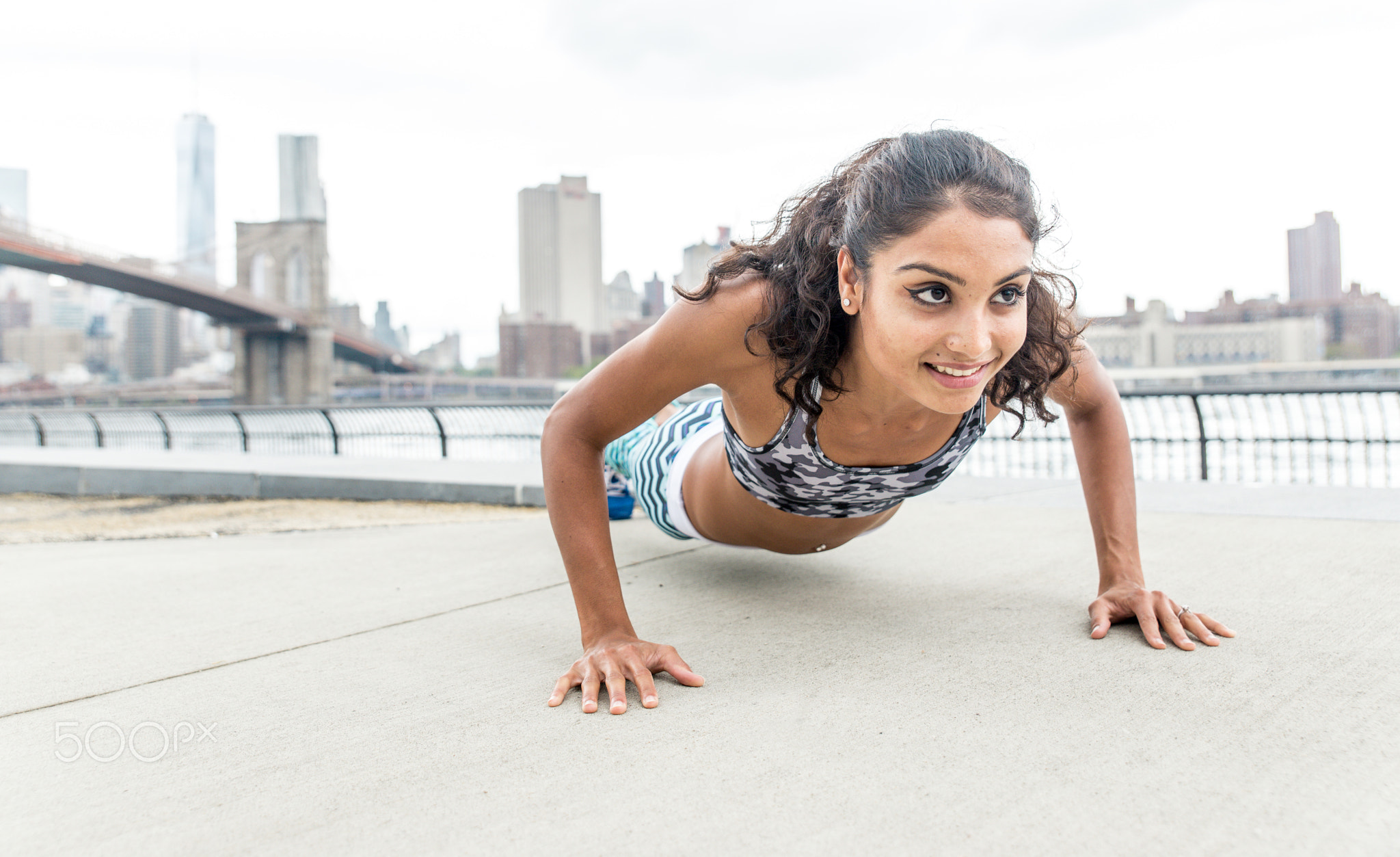 Woman making push up training in New york city