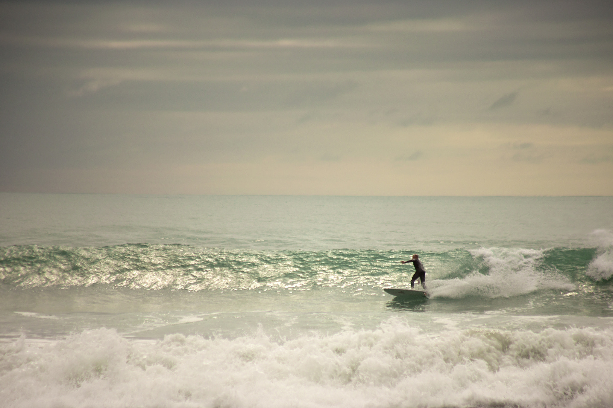 Canon EF 90-300mm F4.5-5.6 sample photo. The surfer photography