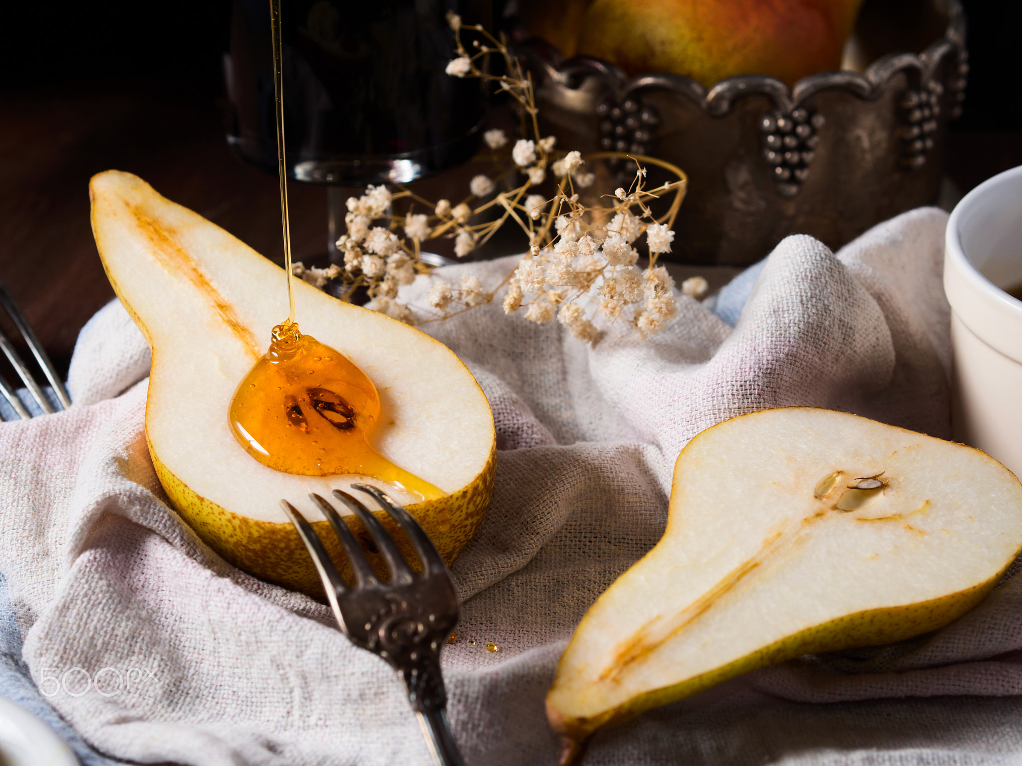Pouring honey on pears