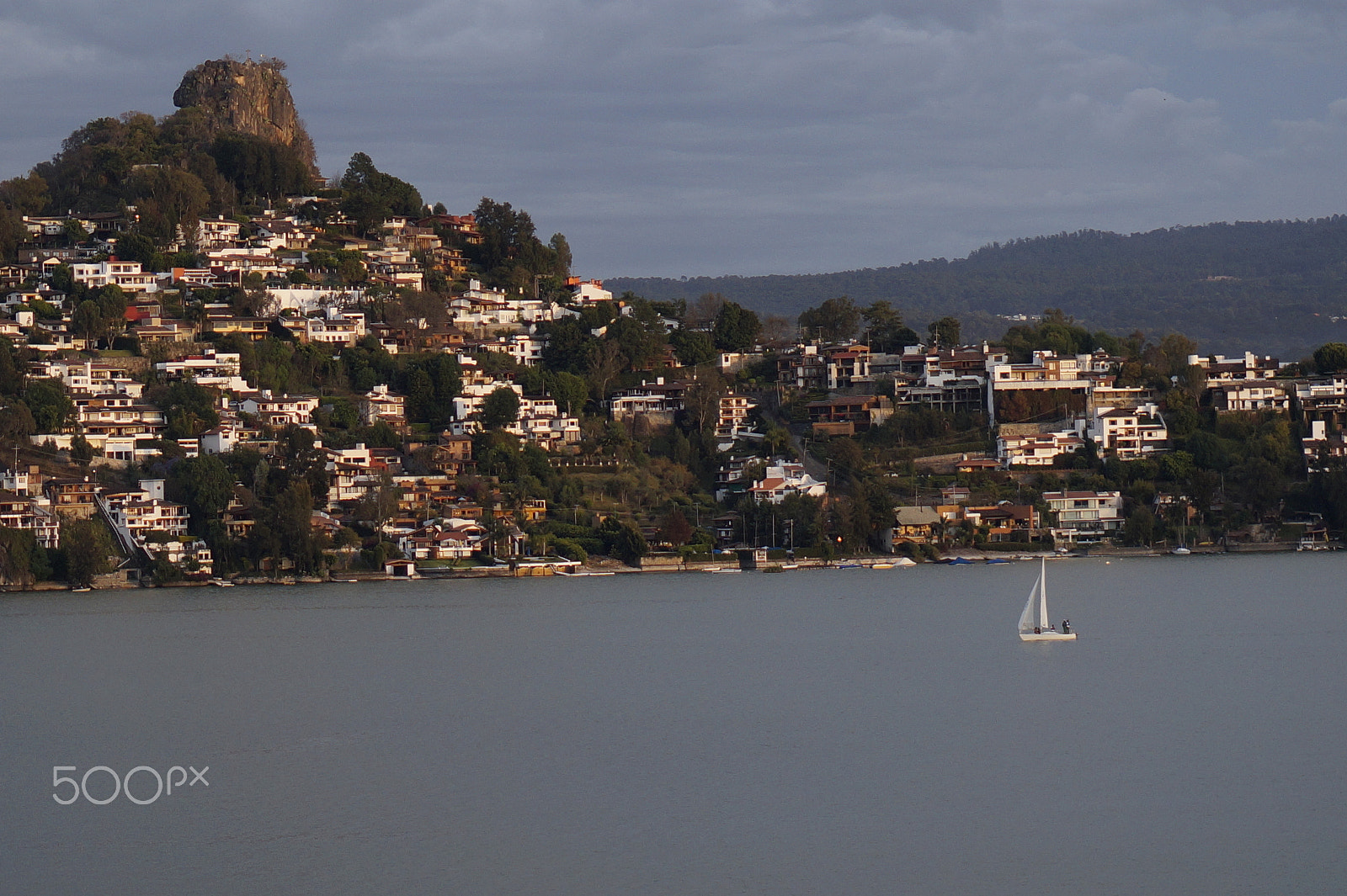 Sony E 50mm F1.8 OSS sample photo. The lake, the boat and the crag photography