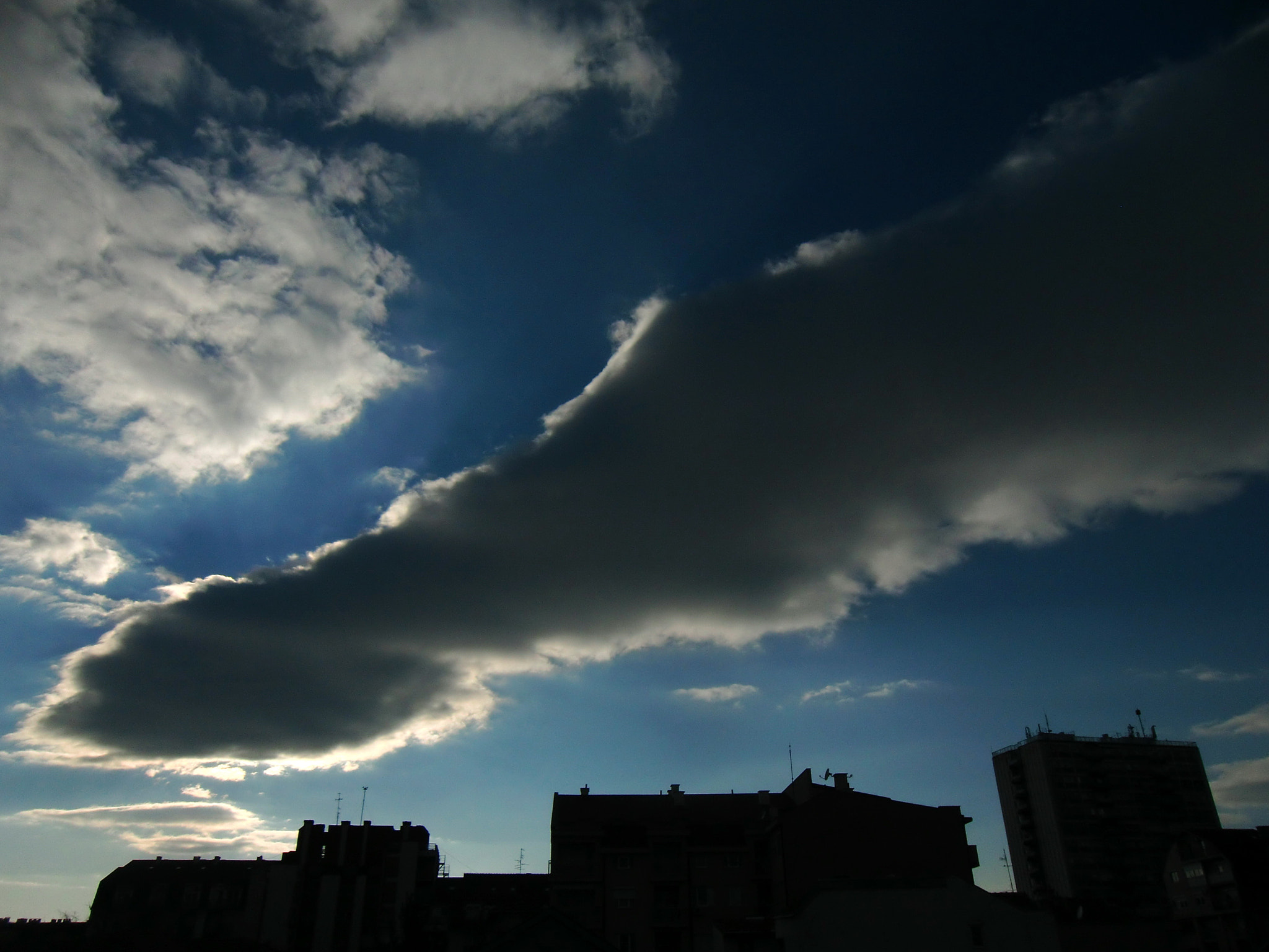 CASIO EX-H10 sample photo. Sun behind a cloud photography