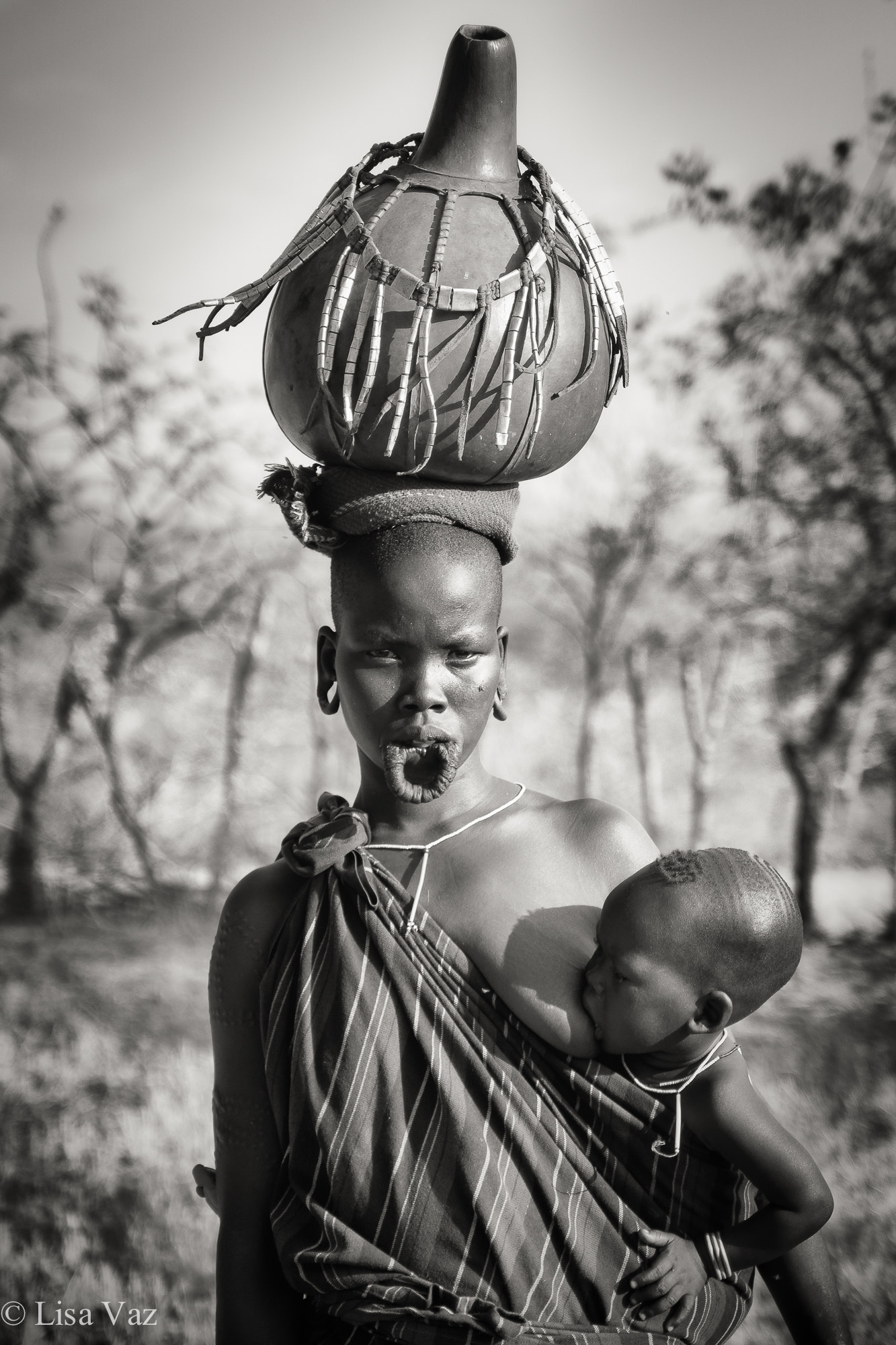 Sony a6000 + Sony Vario Tessar T* FE 24-70mm F4 ZA OSS sample photo. Mursi woman & child photography