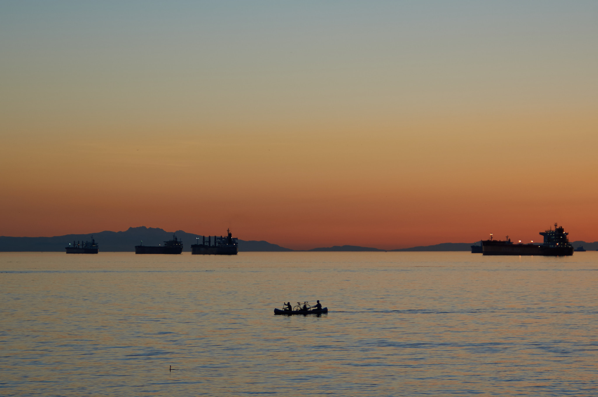 Sony Alpha NEX-6 + 35-70mm F4 sample photo. Two guys and a bike in a canoe photography
