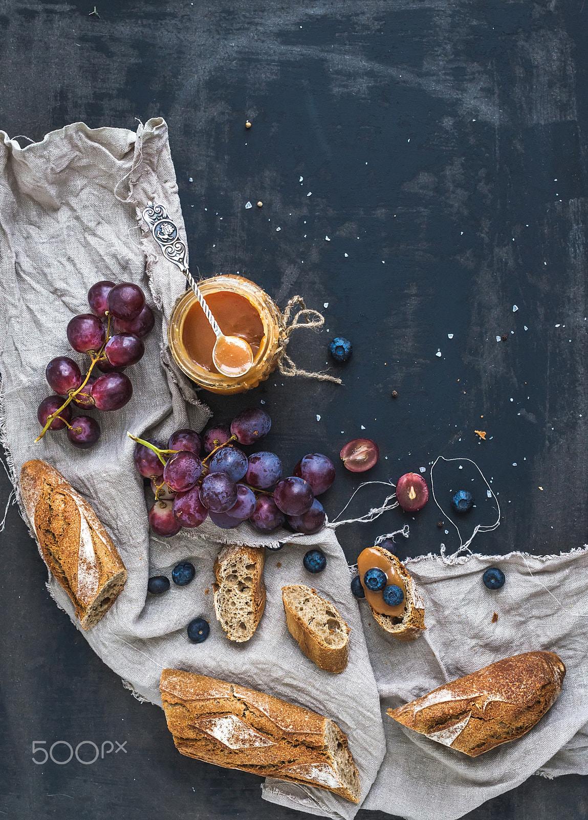 Nikon D610 + ZEISS Distagon T* 35mm F2 sample photo. French baguette cut into pieces, red grapes, blueberry and salt caramel sauce photography