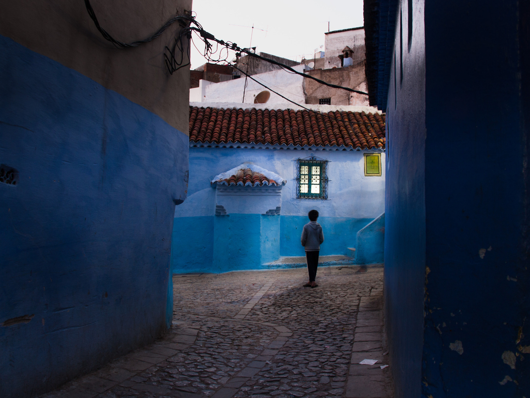 OLYMPUS 18mm-180mm Lens sample photo. A kid on the street photography