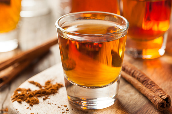 Cinnamon Whiskey Bourbon in a Shot Glass