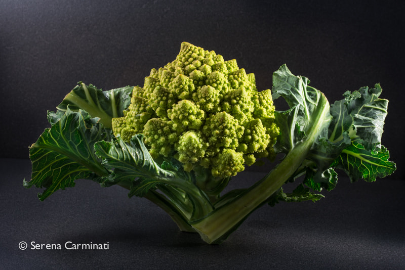Nikon D800 + AF Nikkor 50mm f/1.8 sample photo. Small romanesco cauliflower with leaves photography