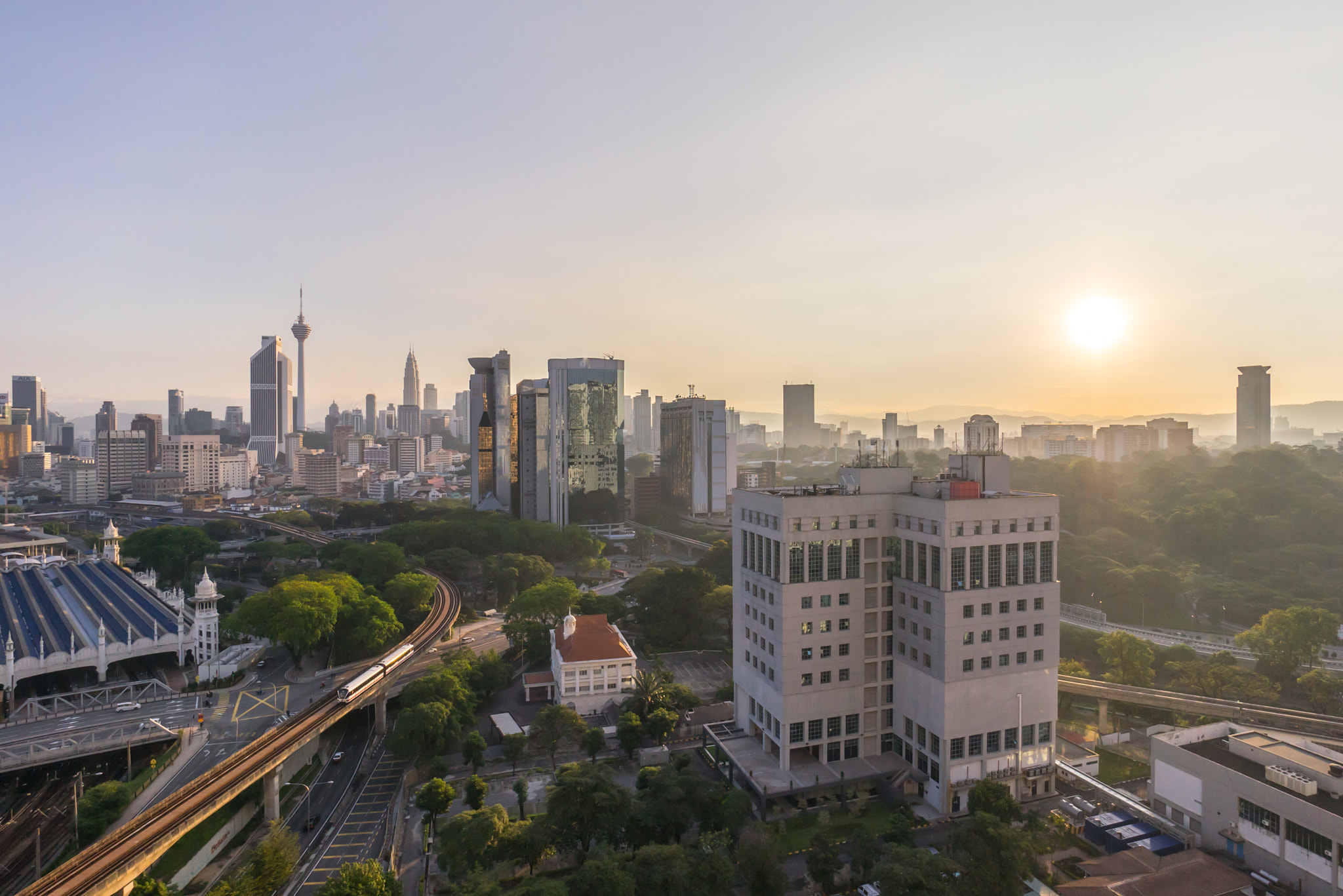 Sony a7R + Sony E 10-18mm F4 OSS sample photo. Beautiful sunrise at kuala lumpur city centre photography