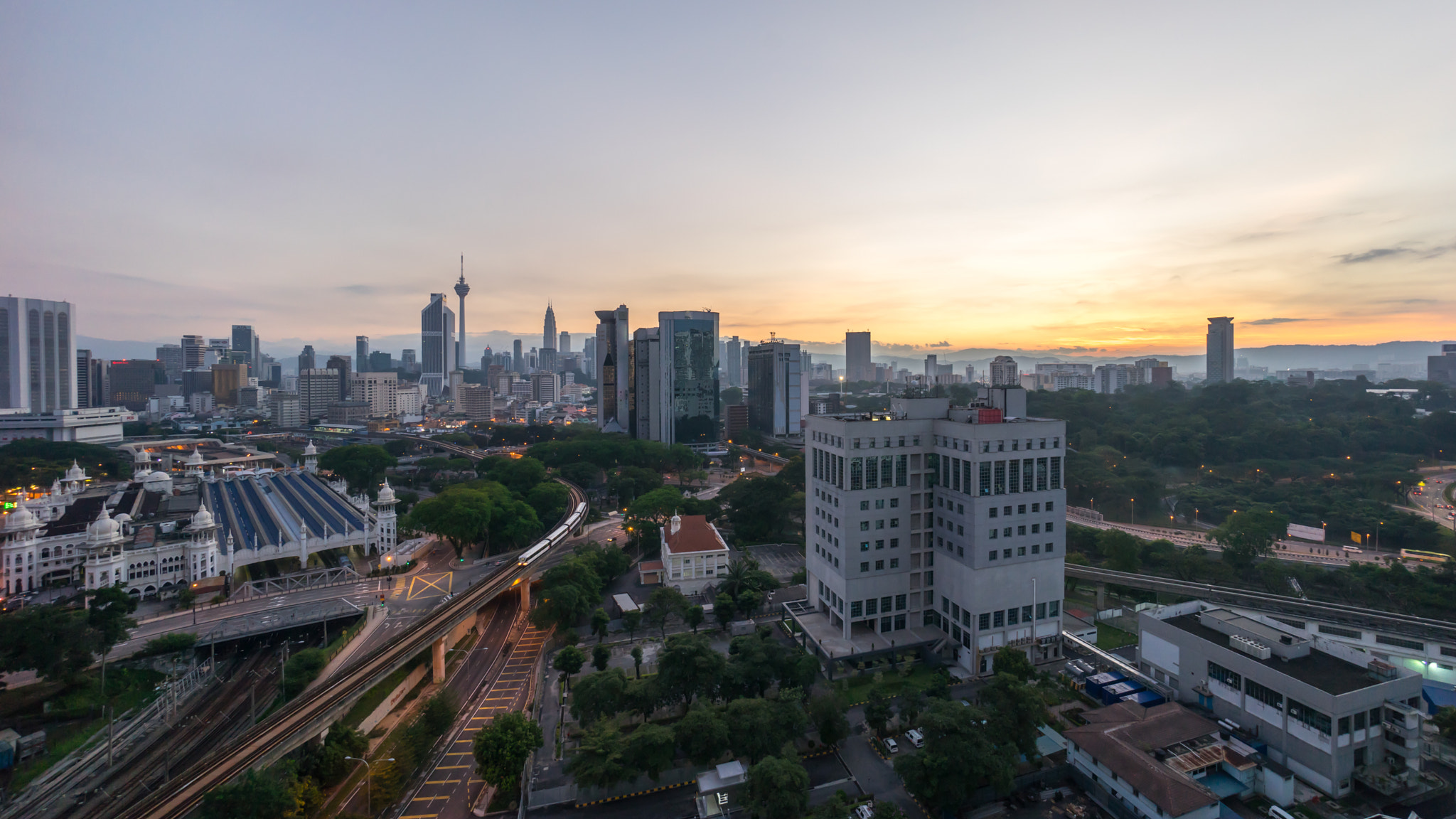 Sony a7R + Sony E 10-18mm F4 OSS sample photo. Beautiful sunrise at kuala lumpur city centre photography