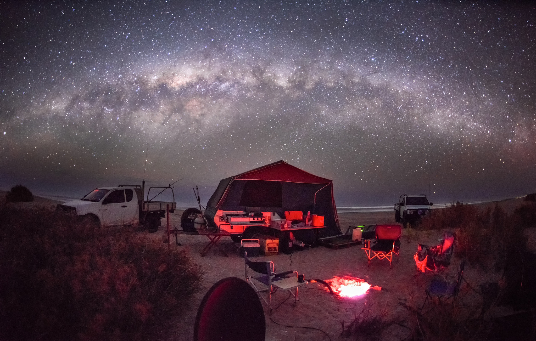 Nikon D810 + Nikon AF Fisheye-Nikkor 16mm F2.8D sample photo. The milky way setting over the beach camp at lucky bay photography