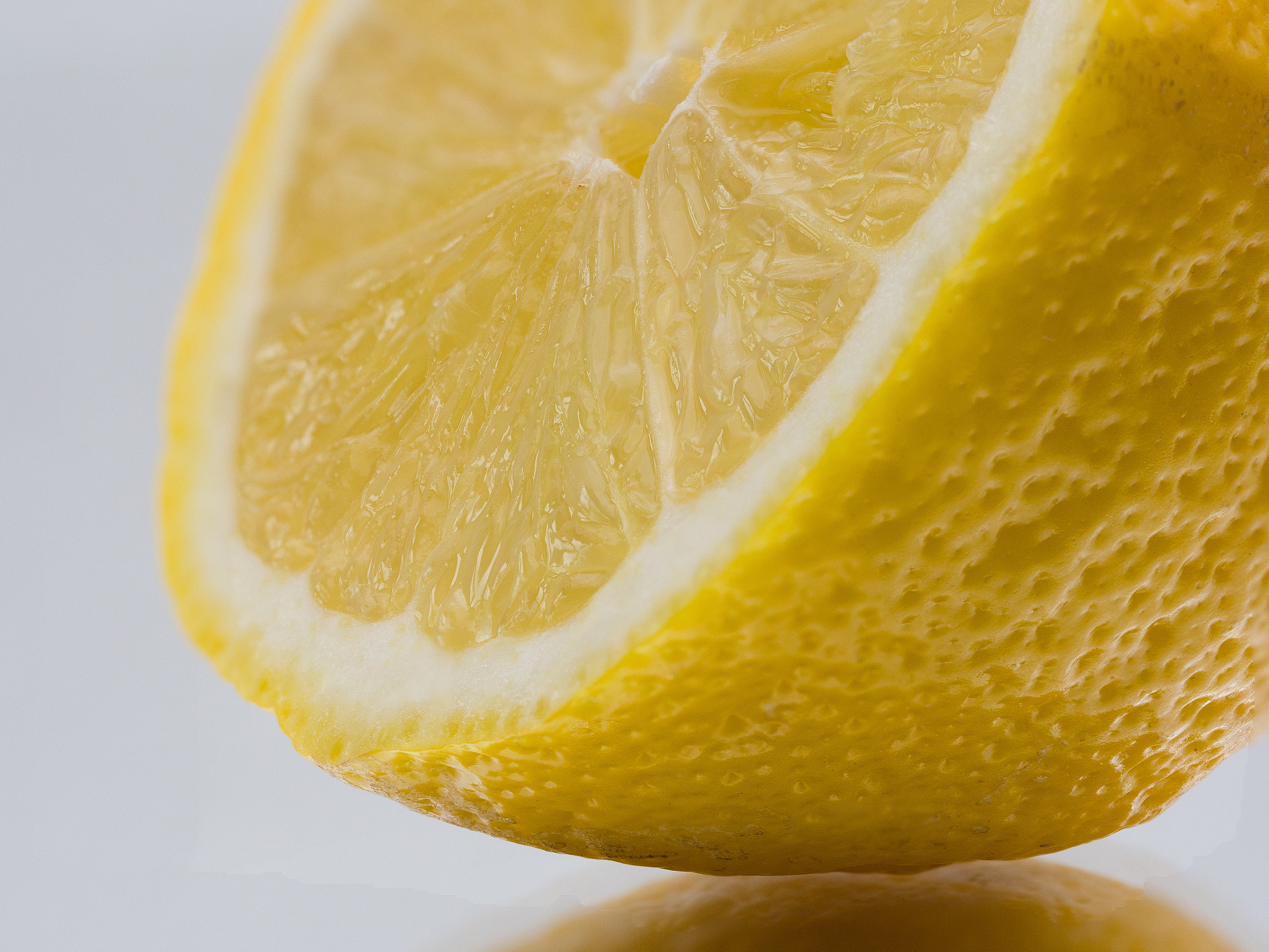 Olympus M.Zuiko Digital ED 60mm F2.8 Macro sample photo. Macro shot lemon slicle on studio table photography