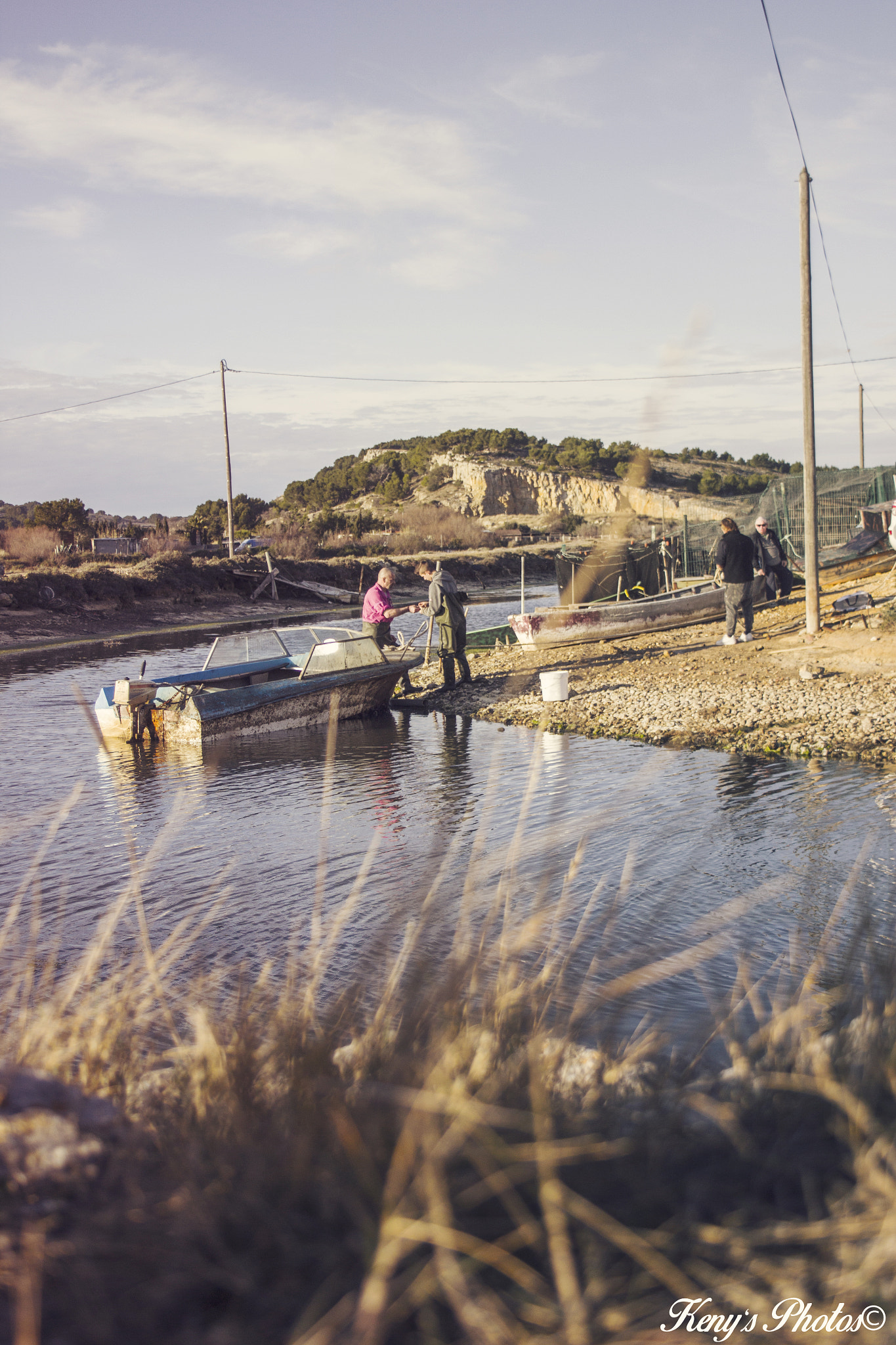 Canon EF-S 18-55mm F3.5-5.6 sample photo. Fisherman working on river photography