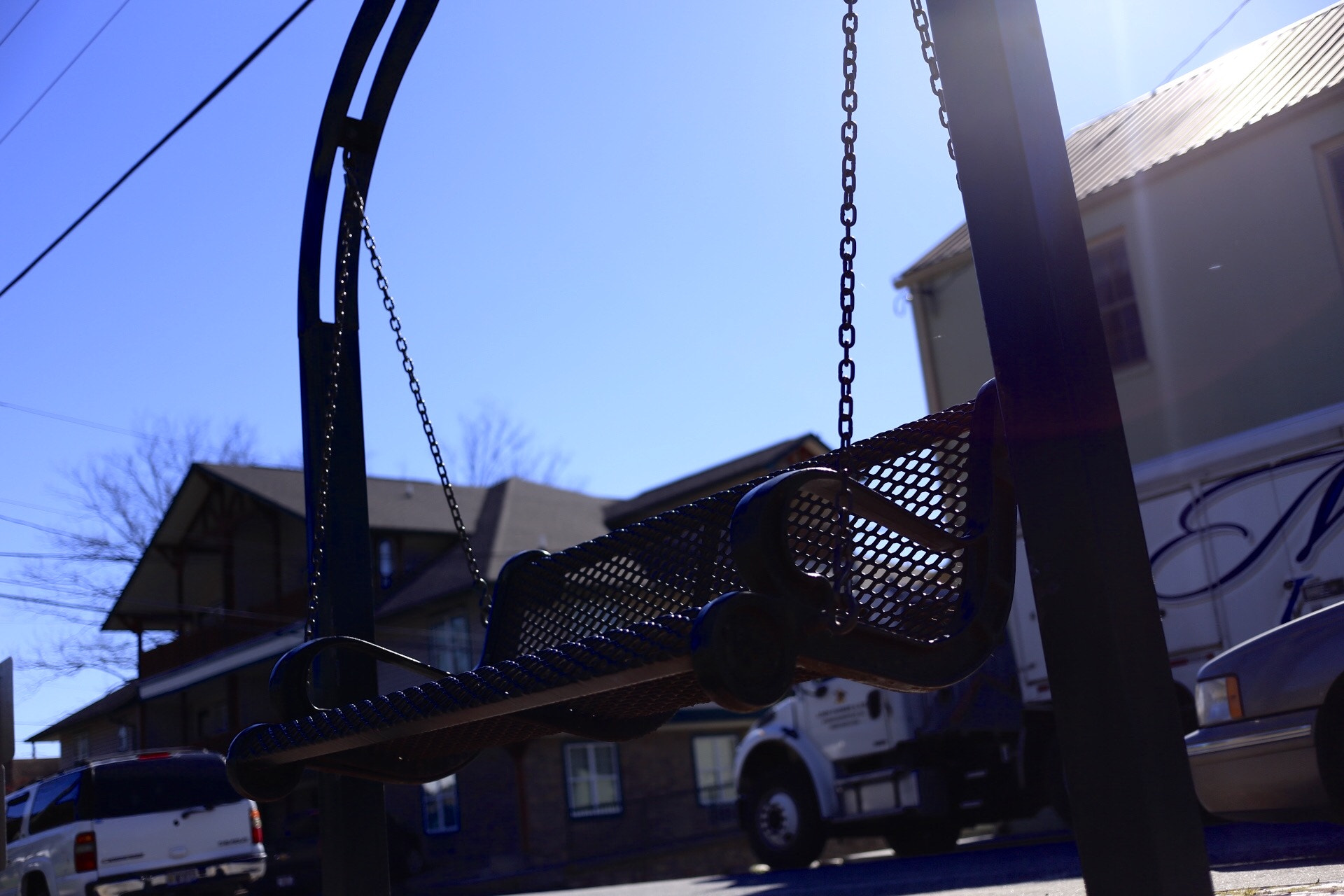 Canon EF 40mm F2.8 STM sample photo. Lonely swinging bench photography