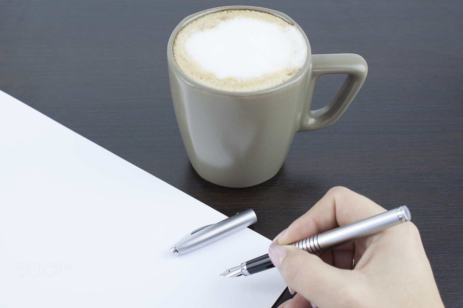 Canon EF-S 18-55mm F3.5-5.6 III sample photo. Hand signing a document in a coffee break photography