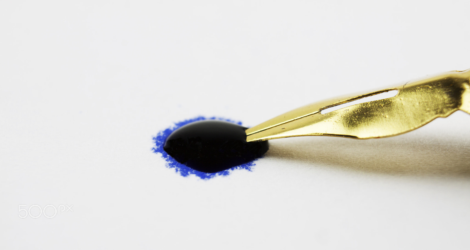Canon EF-S 18-55mm F3.5-5.6 III sample photo. Pen tip in a drop of ink photography
