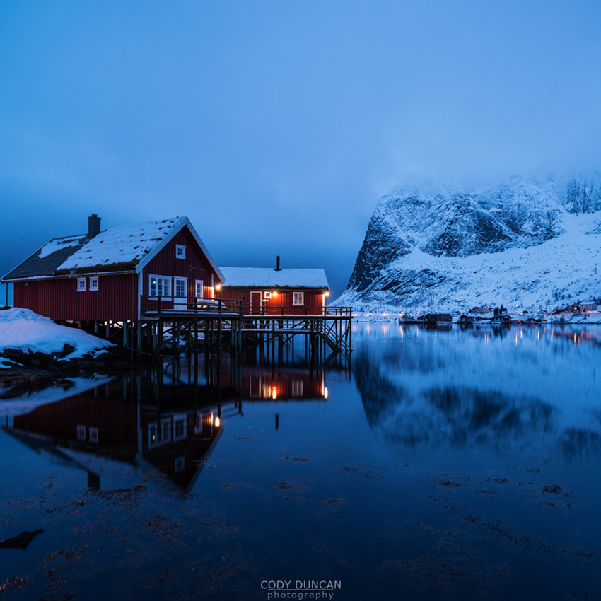 Nikon D800 + Nikon PC-E Nikkor 24mm F3.5D ED Tilt-Shift sample photo. Traditional rorbu cabin reflects in fjord in evening light, valen, reine, moskenesøy, lofoten... photography