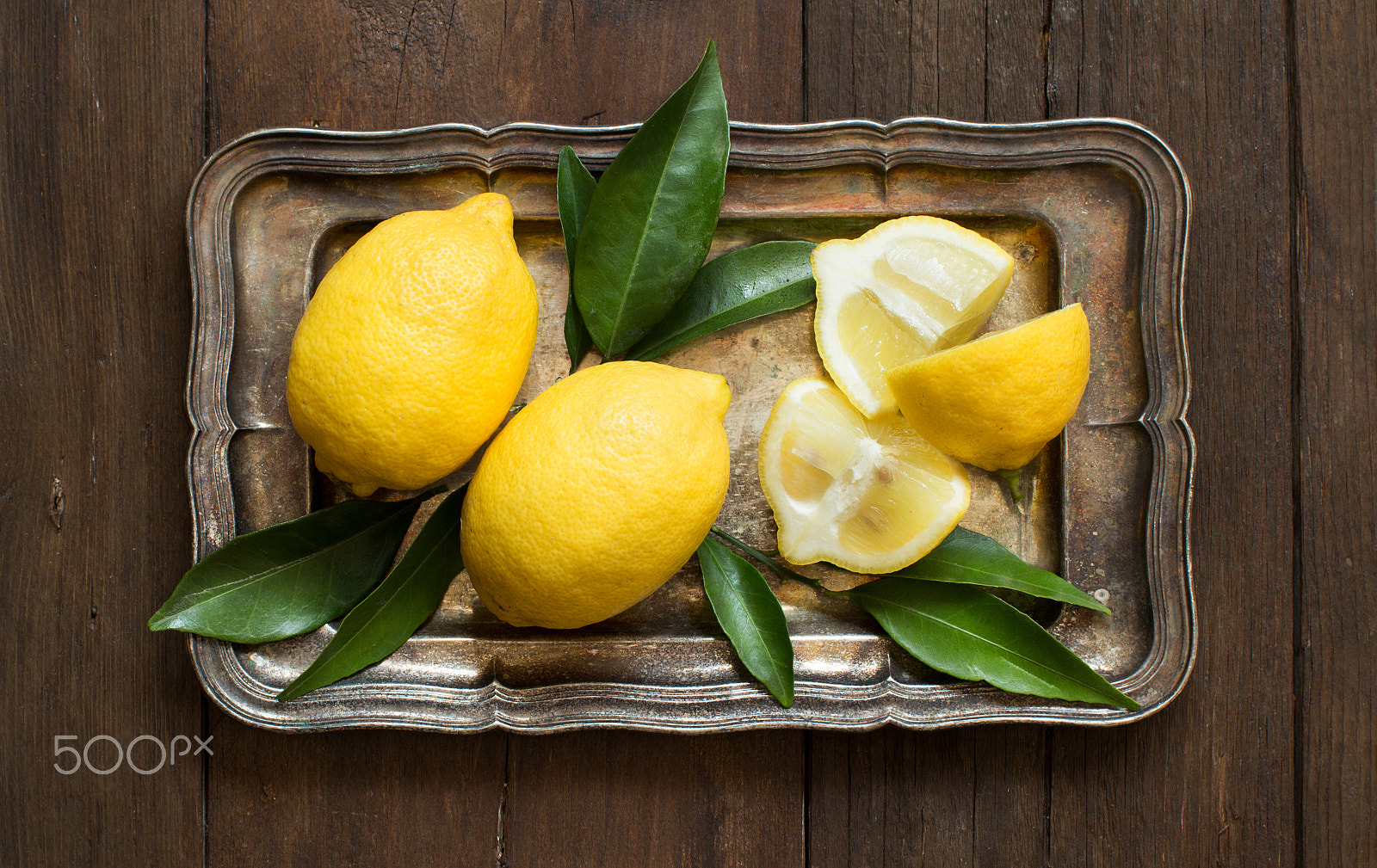 Canon EOS 650D (EOS Rebel T4i / EOS Kiss X6i) + Canon EF 50mm F1.2L USM sample photo. Fresh lemons  on a tray photography