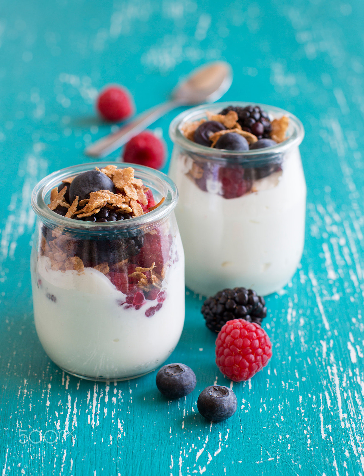 Canon EOS 650D (EOS Rebel T4i / EOS Kiss X6i) + Canon EF 50mm F1.2L USM sample photo. Berries, flakes and fresh yogurt in a jar photography