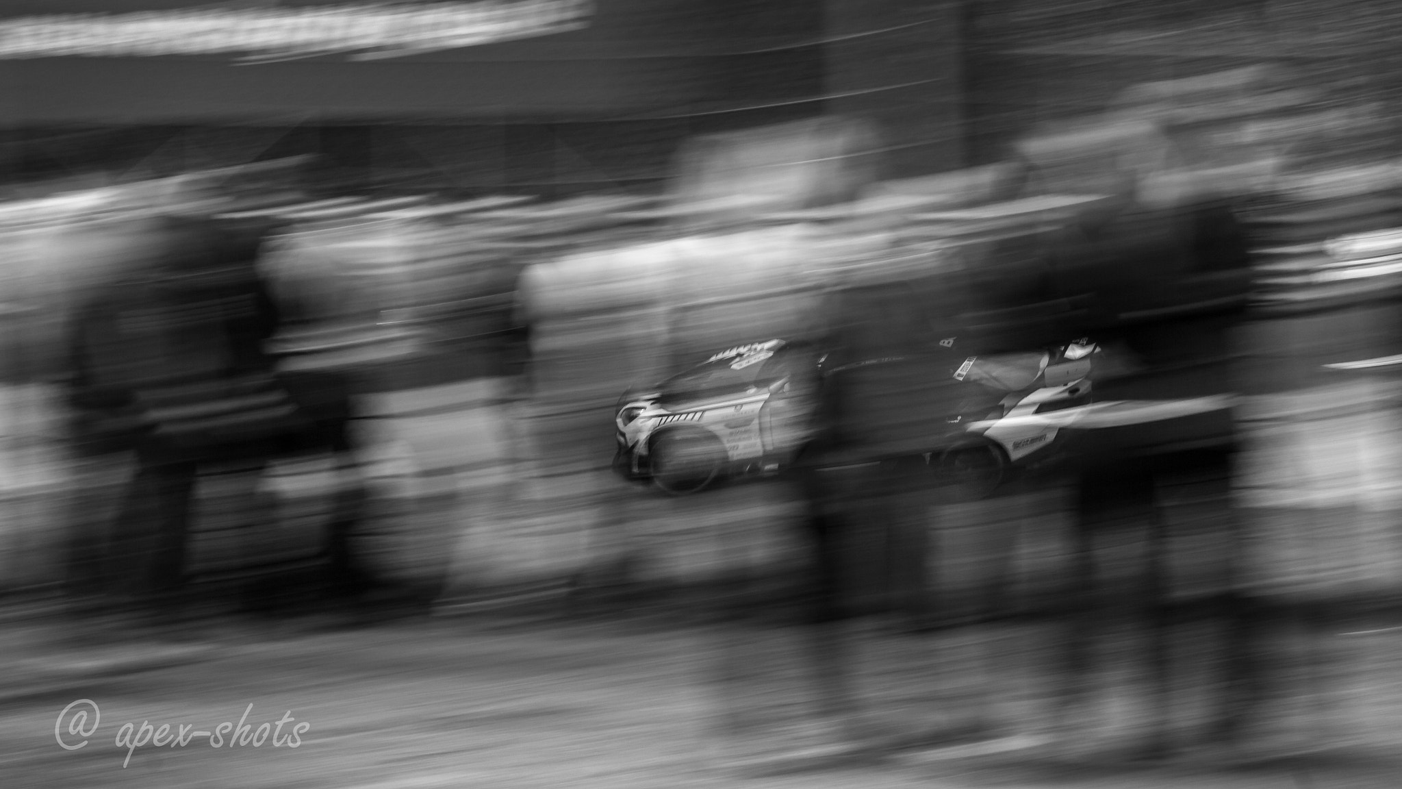 Sigma 70-200mm F2.8 EX DG OS HSM sample photo. Through spectators and the fence photography
