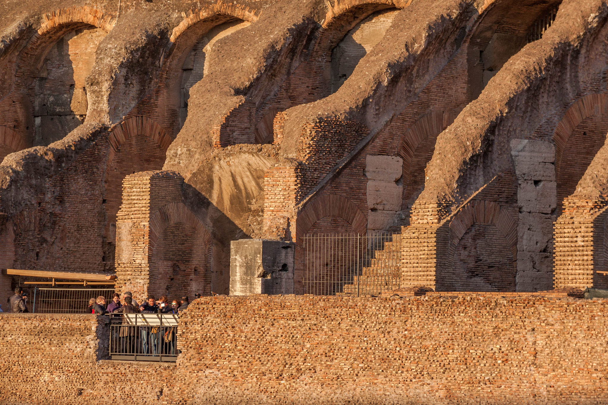 Canon EOS 500D (EOS Rebel T1i / EOS Kiss X3) sample photo. Dwarfed by the ancient colosseum photography