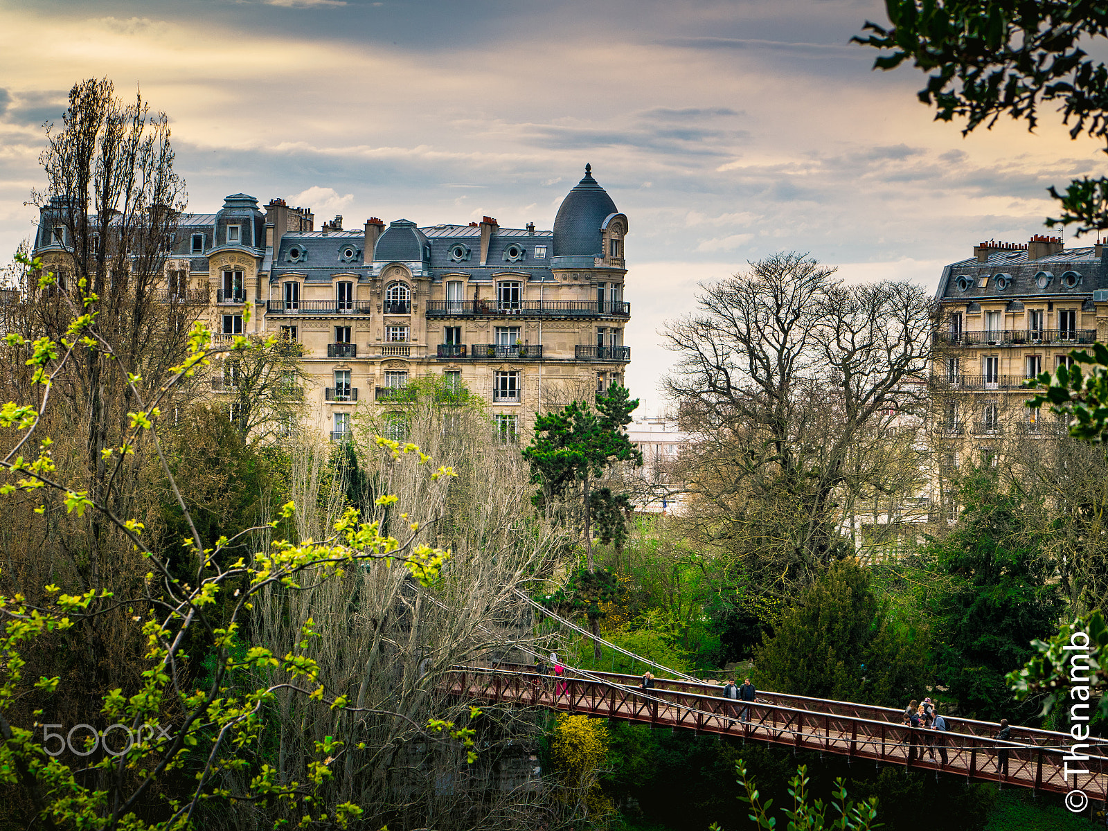 Panasonic Lumix G 42.5mm F1.7 ASPH Power OIS sample photo. Parisian building in front of "la butte chaumont" photography
