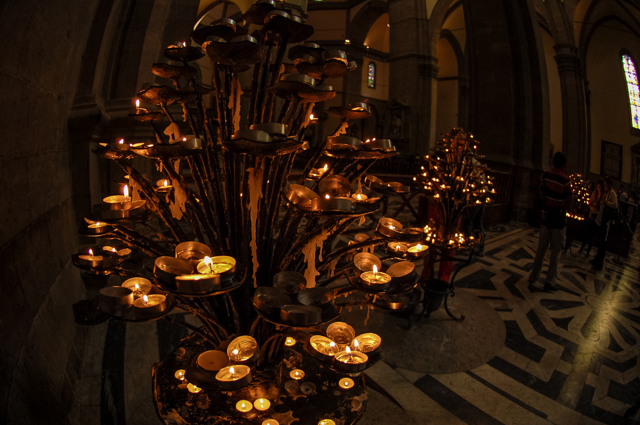 Nikon AF DX Fisheye-Nikkor 10.5mm F2.8G ED sample photo. Candles in duomo photography