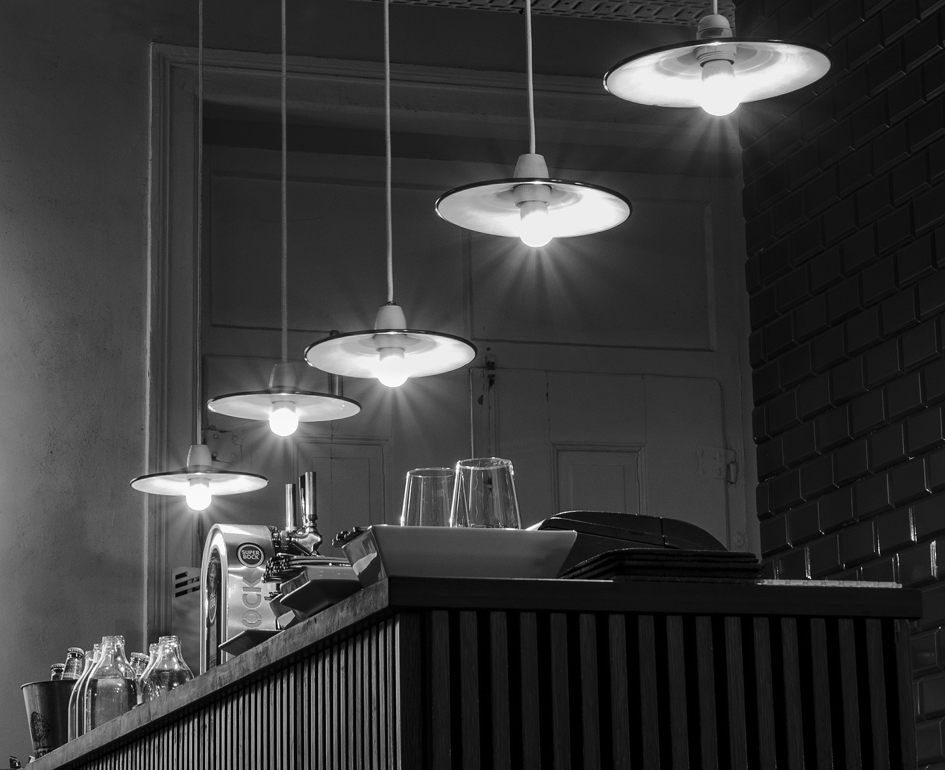 Olympus OM-D E-M5 + Olympus M.Zuiko Digital 25mm F1.8 sample photo. Lisbon bar lights photography