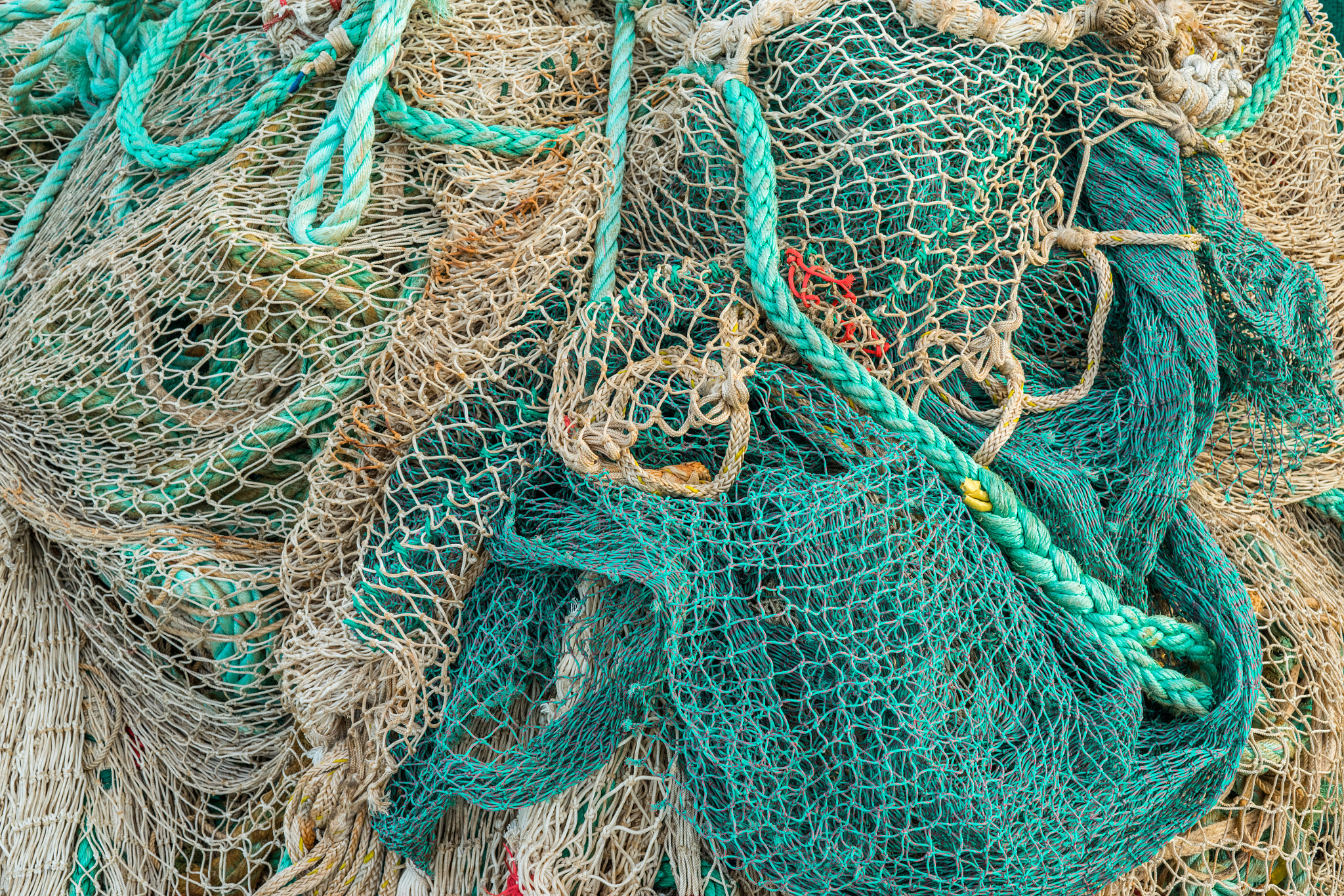 Sony a7R + Sony 50mm F1.4 sample photo. Fishing net by a harbor photography