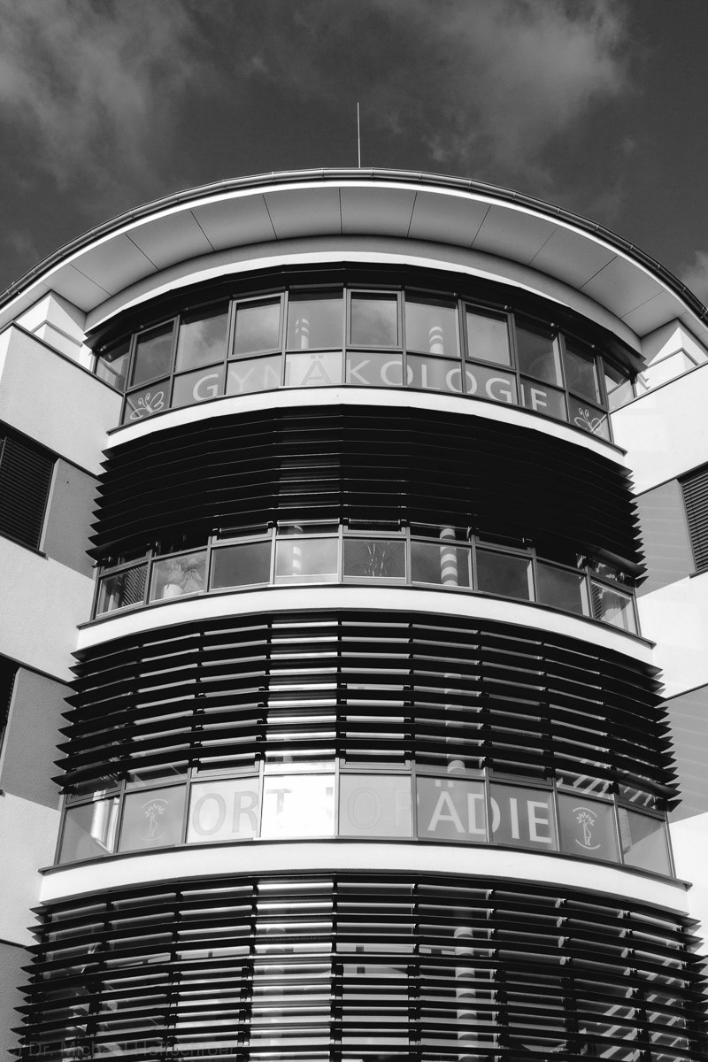 Canon EF-S 18-55mm F3.5-5.6 sample photo. Round house glass front in black and white photography