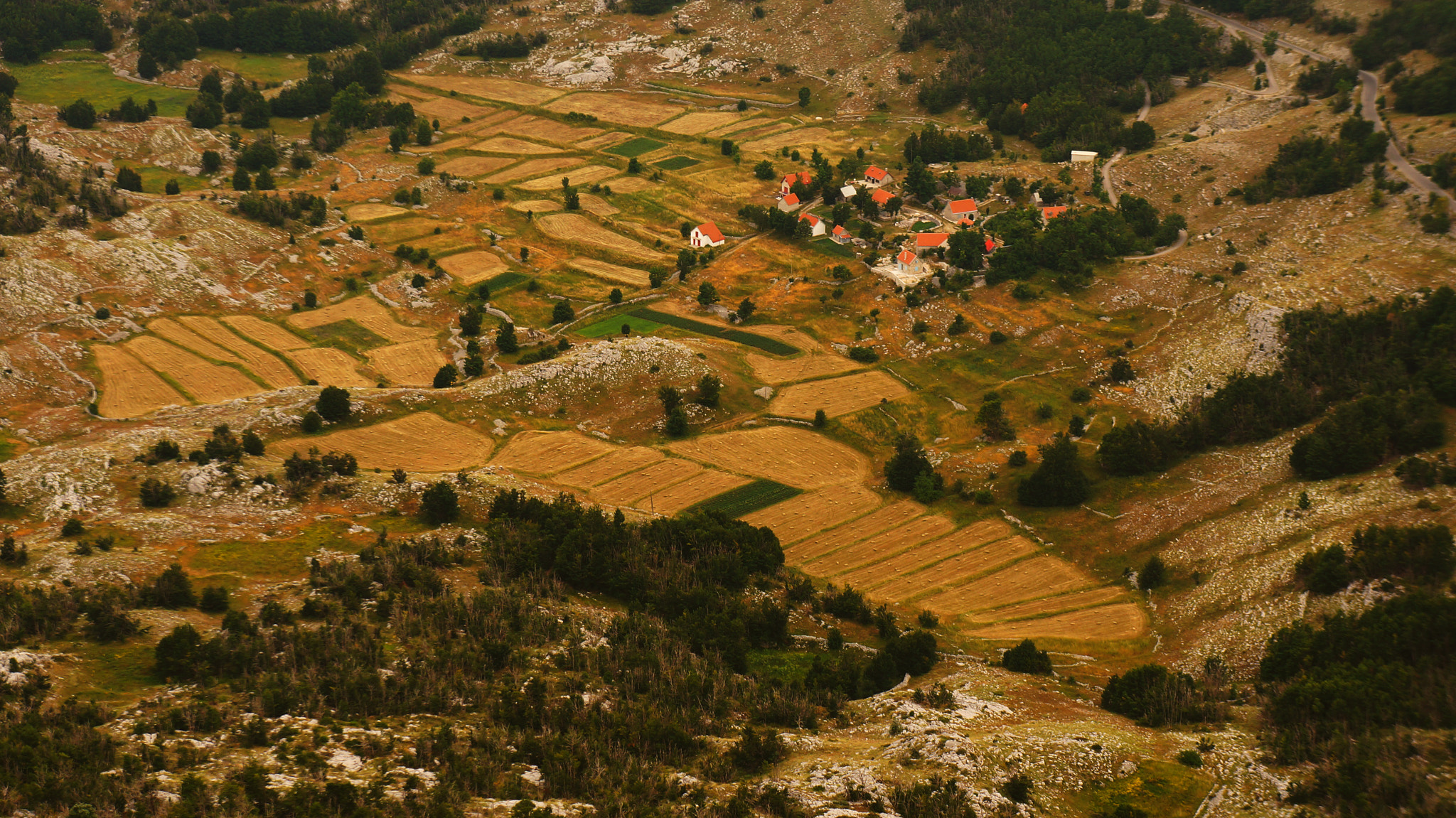 Sony E 18-55mm F3.5-5.6 OSS sample photo. Little boxes on the hillside photography